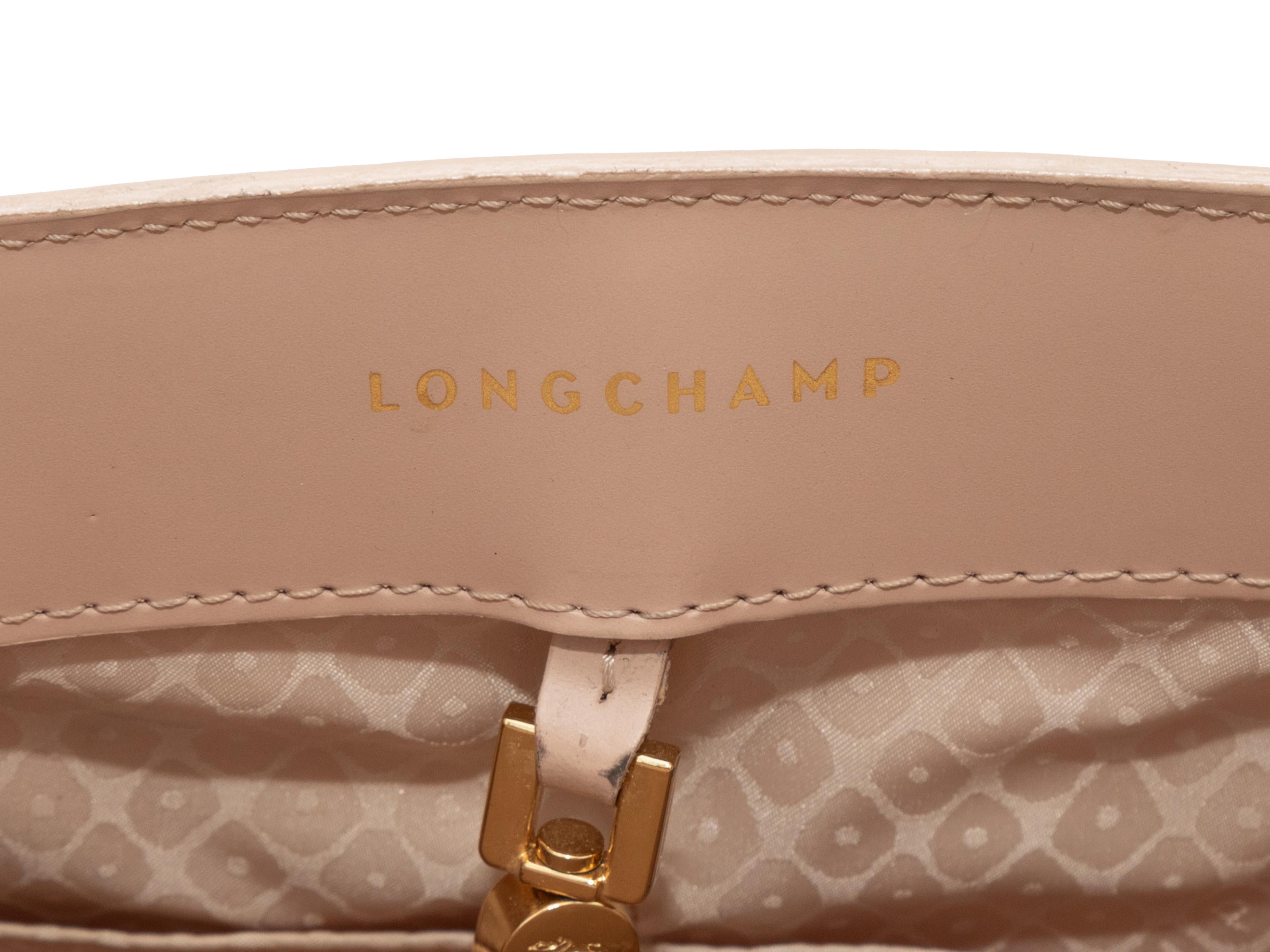 Blush Longchamp Leather Shoulder Bag. This bag features a leather body, gold-tone hardware, dual flat top handles, and a single flat shoulder strap. 12