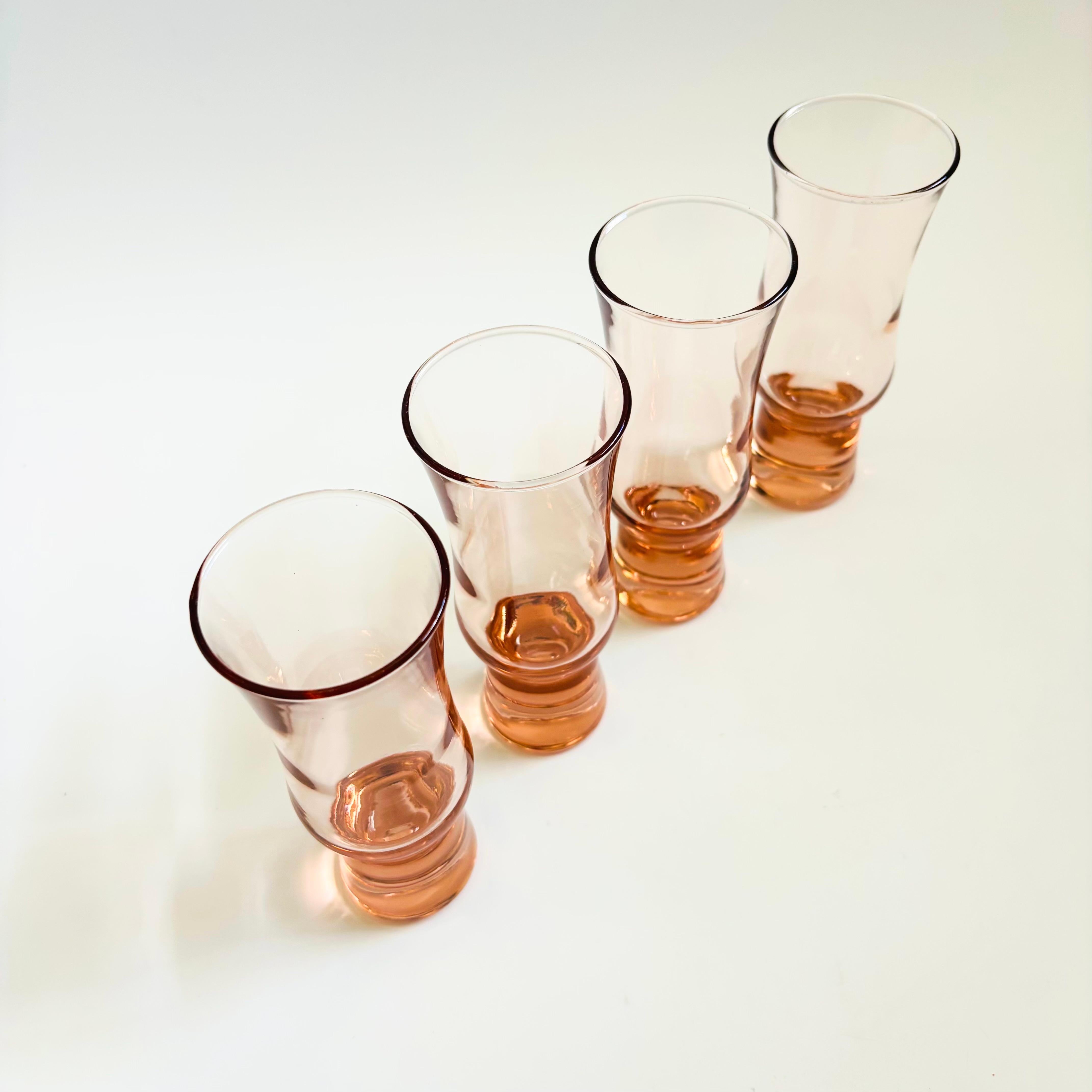 A lovely set of 4 vintage pale pink glasses. Curvy tops with tapered weighted bases. Perfect for champagne or cocktails

