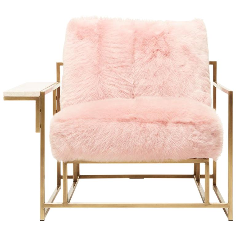 The refined design of the Inheritance Armchair is juxtaposed here with a luxurious and plush shearling upholstery set in a contemporary color palette. 

This variation is upholstered in ultra-soft blush pink shearling. The foam seat cushions have a