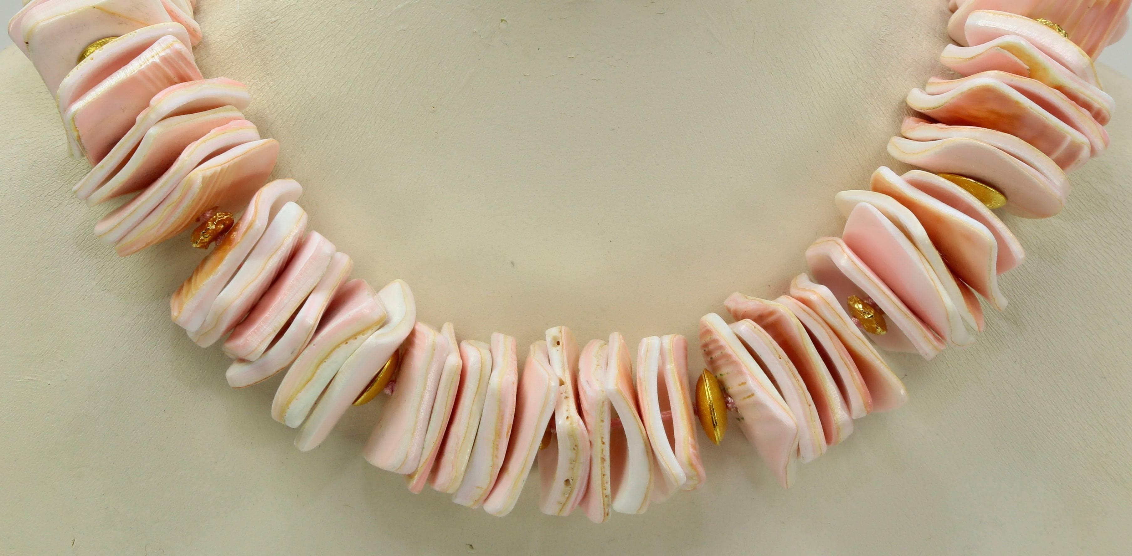 Beautiful and Dynamic Necklace showcasing soft Pink Square Cushion Shape Queen Conch Shell Beads, each measuring approx. 24mm; accented by gilded sterling silver spacers; Hand knotted on matching pink thread and finished with a complementary Gilded