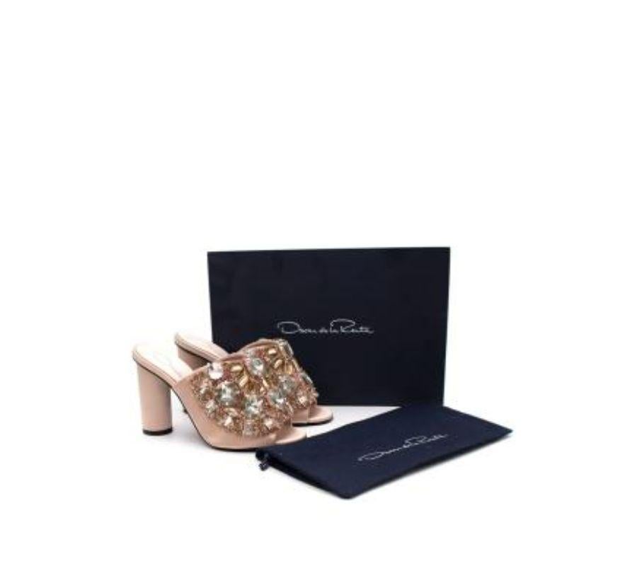 Oscar de la Renta Blush Satin Crystal Studded Heeled Mules
 
 - Blush pink satin wrapped mules with richly embellished crystal uppers
 - Set on a high block heel
 
 Materials: 
 Satin
 Glass
 
 Made in Italy 
 
 PLEASE NOTE, THESE ITEMS ARE