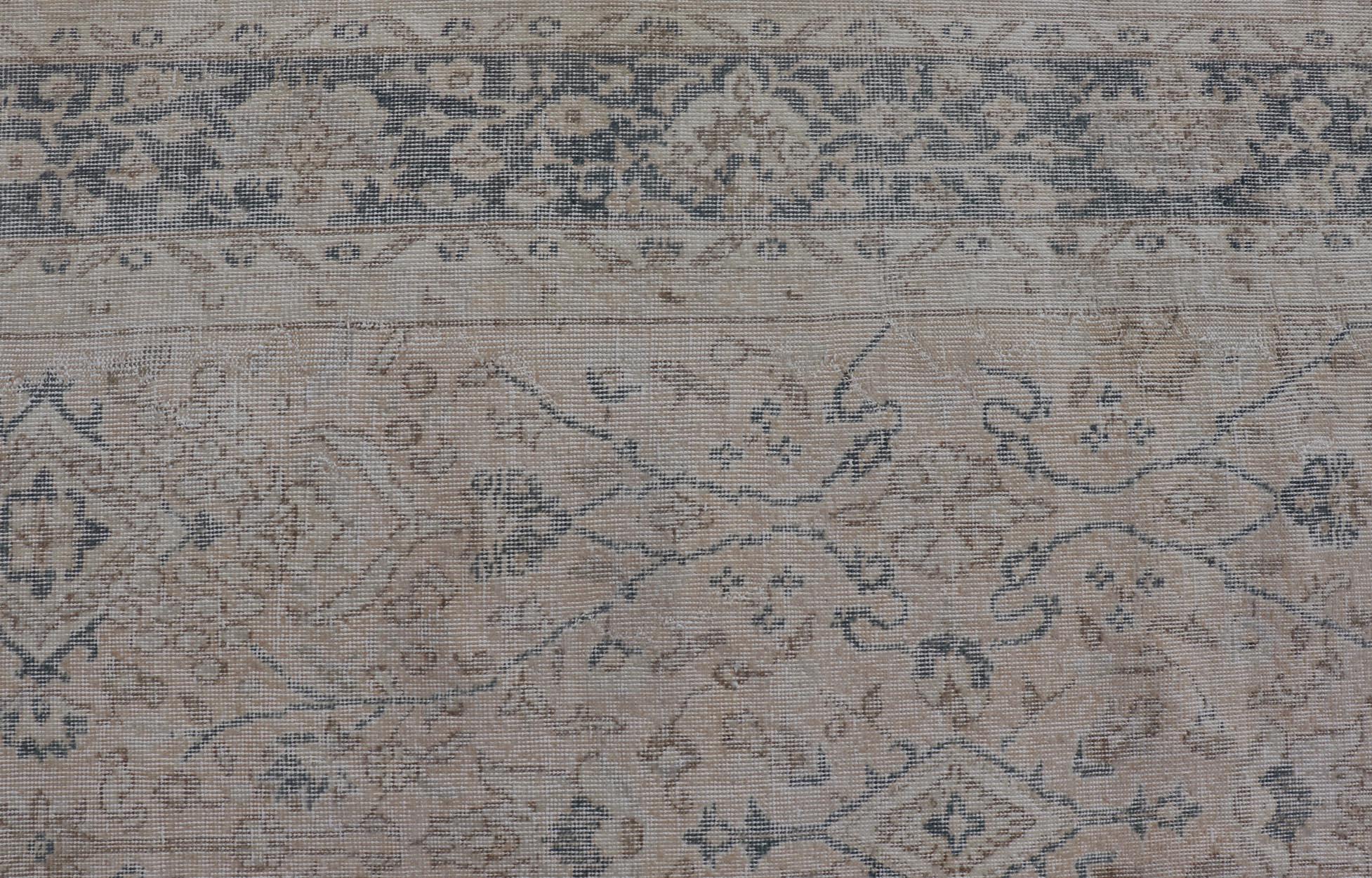 Hand-Knotted Blush, Tan, & Blue Vintage Turkish Distressed Rug with All-Over Floral Design For Sale