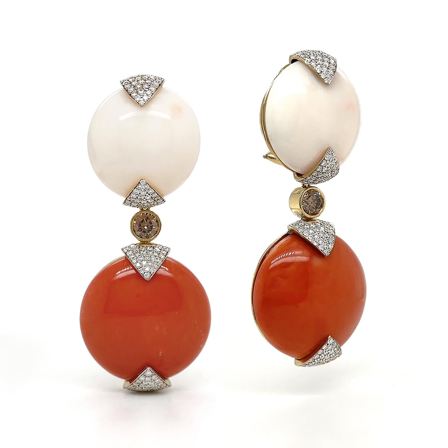 Exceptional white blush and red corals are heightened by the sparkle of white and cognac diamonds. A round-cut white coral begins the motif and is secured by triangle prongs encrusted with brilliant-cut diamonds. The upper triangle is down-turned,