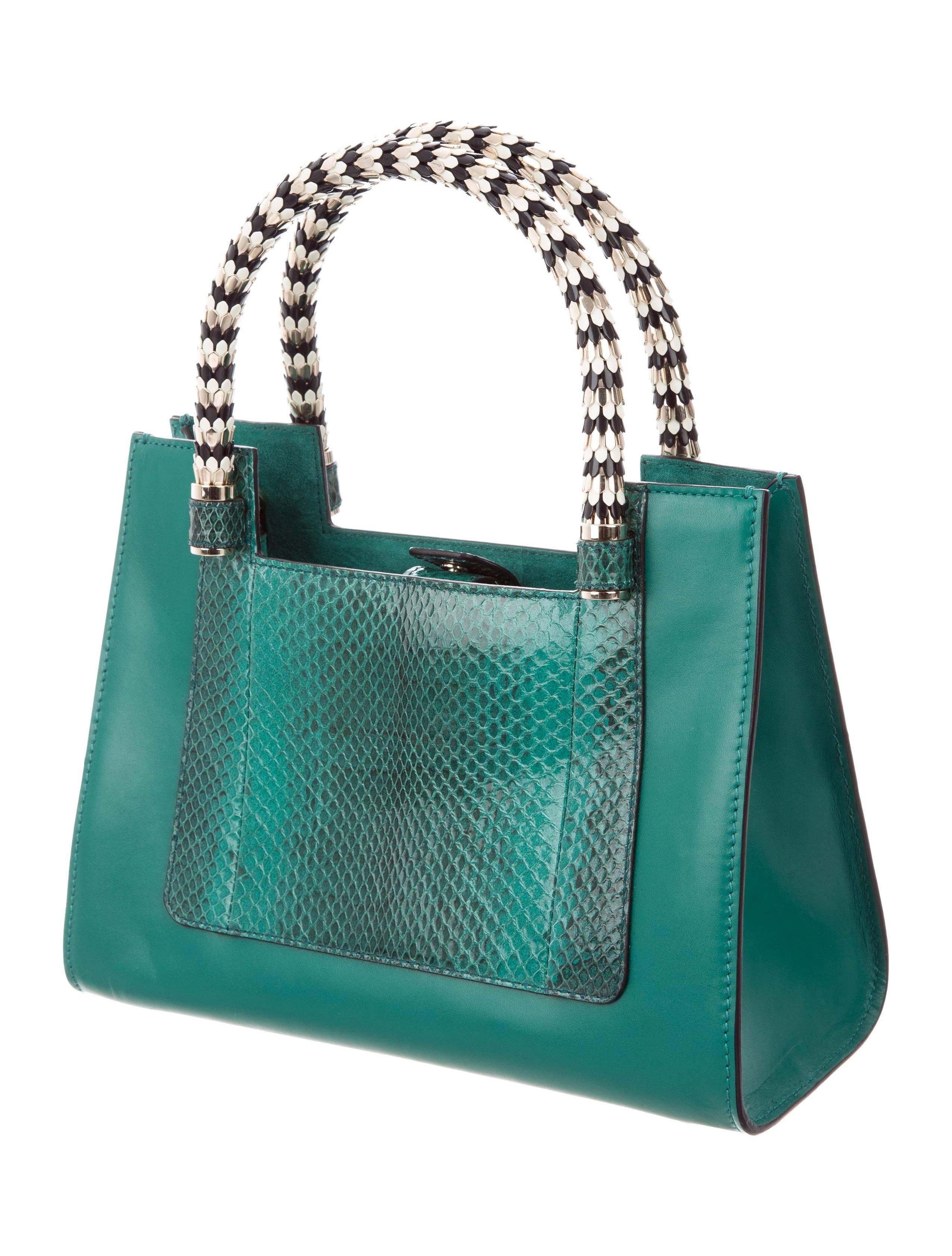 Bulgari NEW Teal Leather Gold Metal Evening Top Handle Kelly Style Satchel Bag

Leather
Snakeskin trim
Gold tone hardware
Suede lining
Snap closure 
Handle drop 5