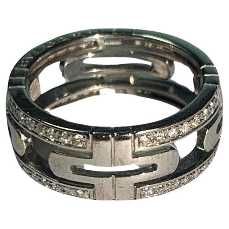 Brand : BLVGARI
Description: BLVGARI Open Parentesi 18K White Gold Diamond Ring 
Metal Type:  18K/White Gold
Weight  6.87g
Size: 55
Condition: Preowned; small signs of wearing
Box -   Not Included
Papers -  Not Included
