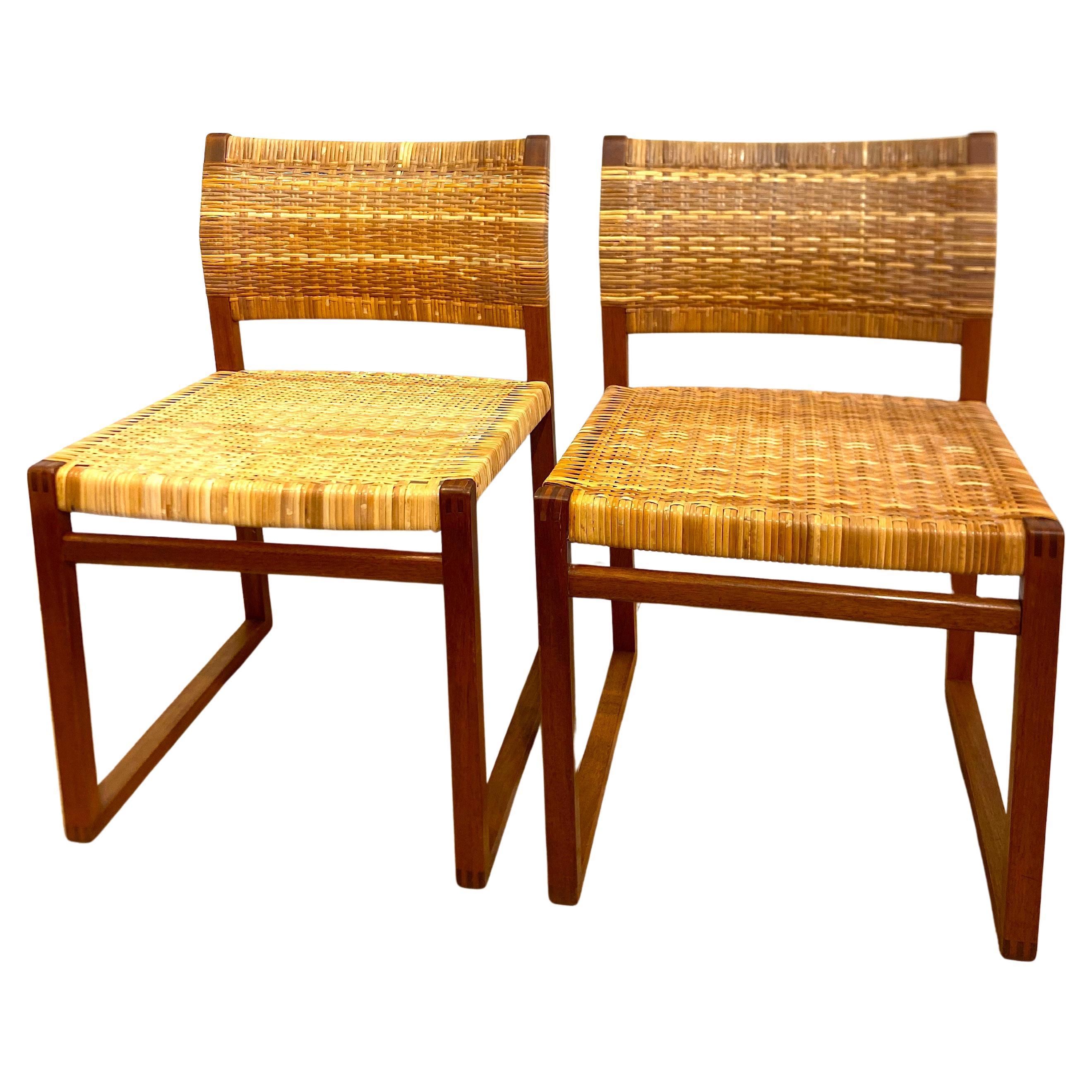 Rare BM-61 chairs in mahogany and rattan by Borge Mogensen for P. Lauritsen & Son. A simple, functional and highly architectural design in the Mogensen style, with the beautiful mahogany joints highlighted. Mogensen was so fond of these chairs that