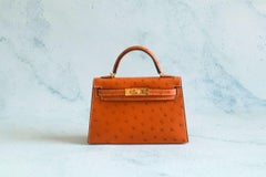 BNIB Hermes Mini Kelly HSS Cognac Ostrich with Craie Stitching GHW G Stamp 2026