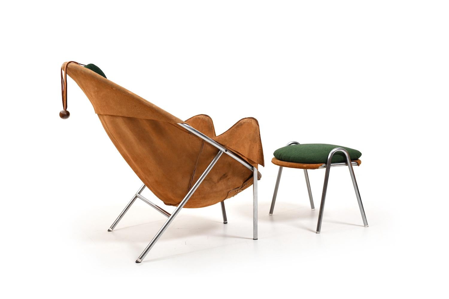 Rare offered lounge chair and footstool, model BO-360 by Erik Ole Jørgensen for Bovirke Denmark 1953. In cognac colored natural suede leather and green cushions. Base in chromed metal. Original condition! Denmark, 1950s. The footstool comes with new