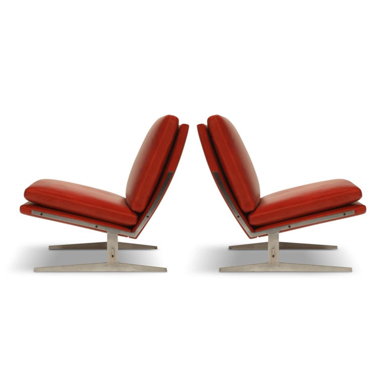 Sleek and stylish pair of early production BO-561 Lounge Chairs by Preben Fabricius & Jørgen Kastholm for Bo-Ex, in soft and incredibly vibrant red leather over cut steel frame. Designed in 1962 and produced in the mid-late 1960s in Denmark, this