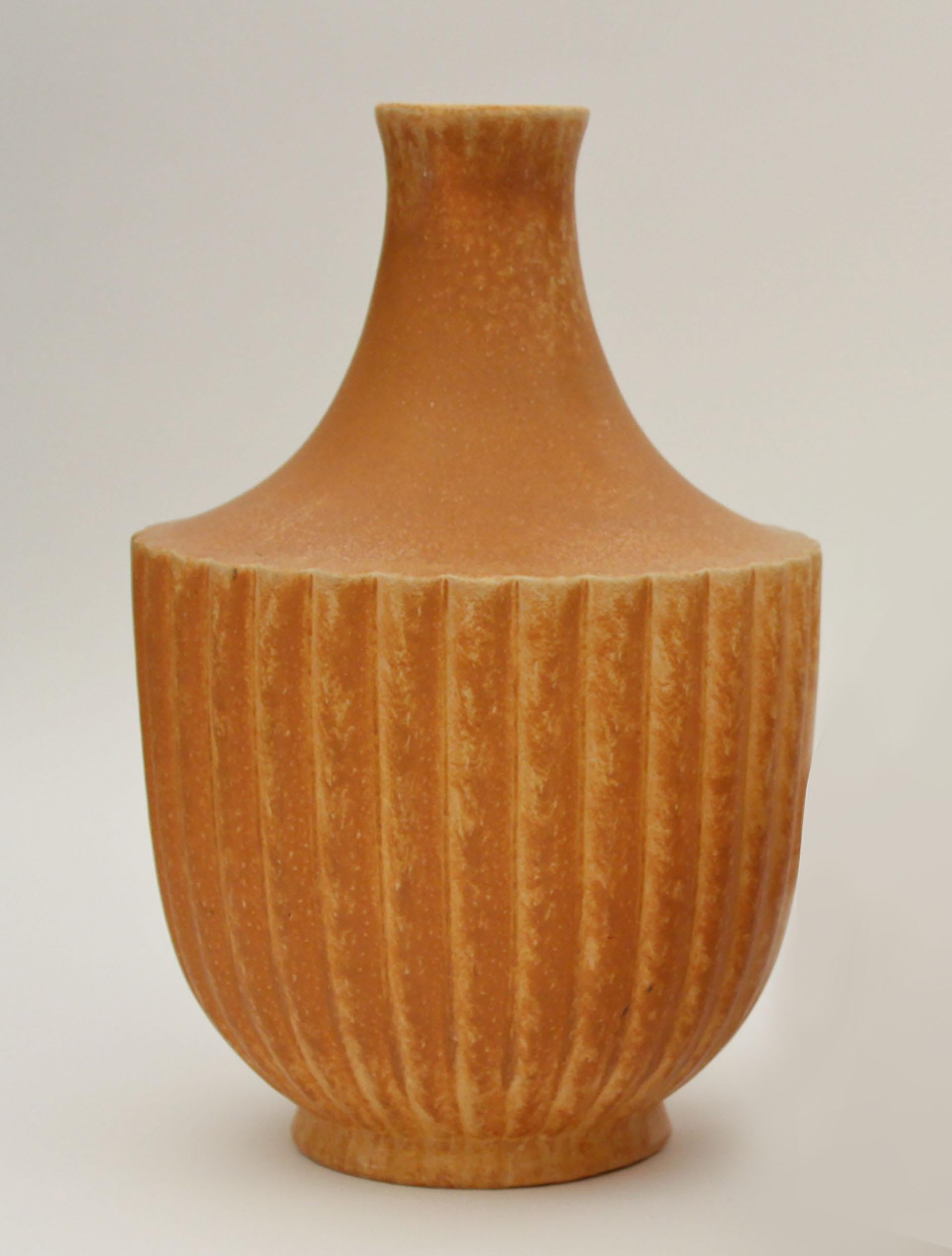 Of neoclassic) form, fluted body, orange glaze. Firms marks (Presentation piece for crafts competition.
     