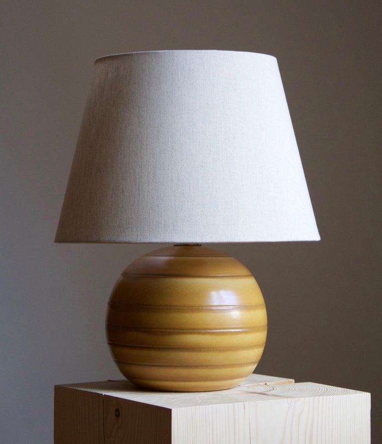 An early modernist table lamp. Bo Fajans, Sweden, 1930s. Marked and labeled.

Lampshade not included. Stated dimensions excluding lampshade. Height includes socket.

Other designers of the period include Ettore Sottsass, Carl Harry Stålhane,