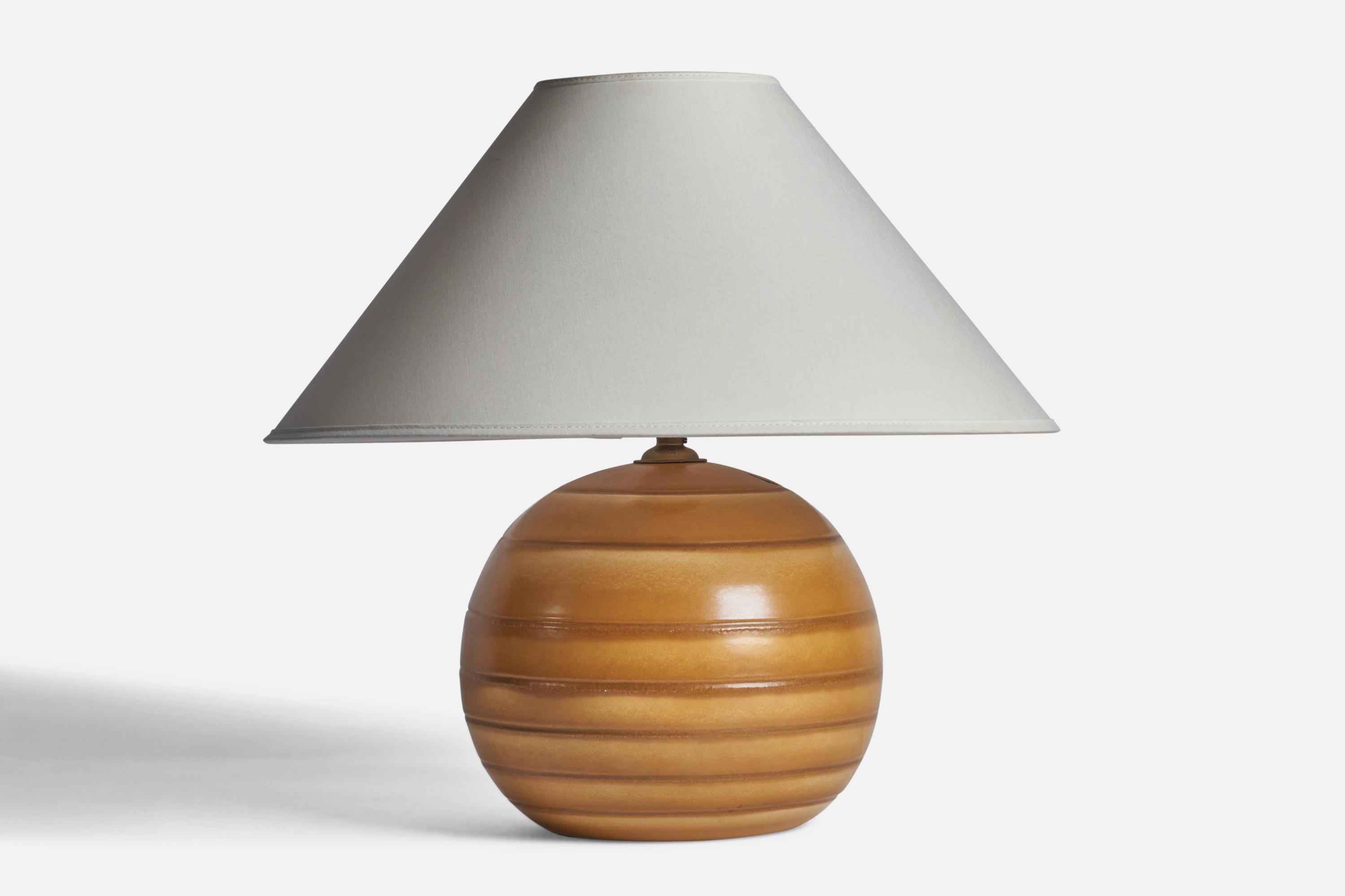 A beige-glazed and incised earthenware table lamp designed and produced by Bo Fajans, Sweden, 1940s.
”MADE IN SWEDEN 4487/6” stamp on bottom 

Dimensions of Lamp (inches): 10.5” H x 9” Diameter
Dimensions of Shade (inches): 4.5” Top Diameter x 16”