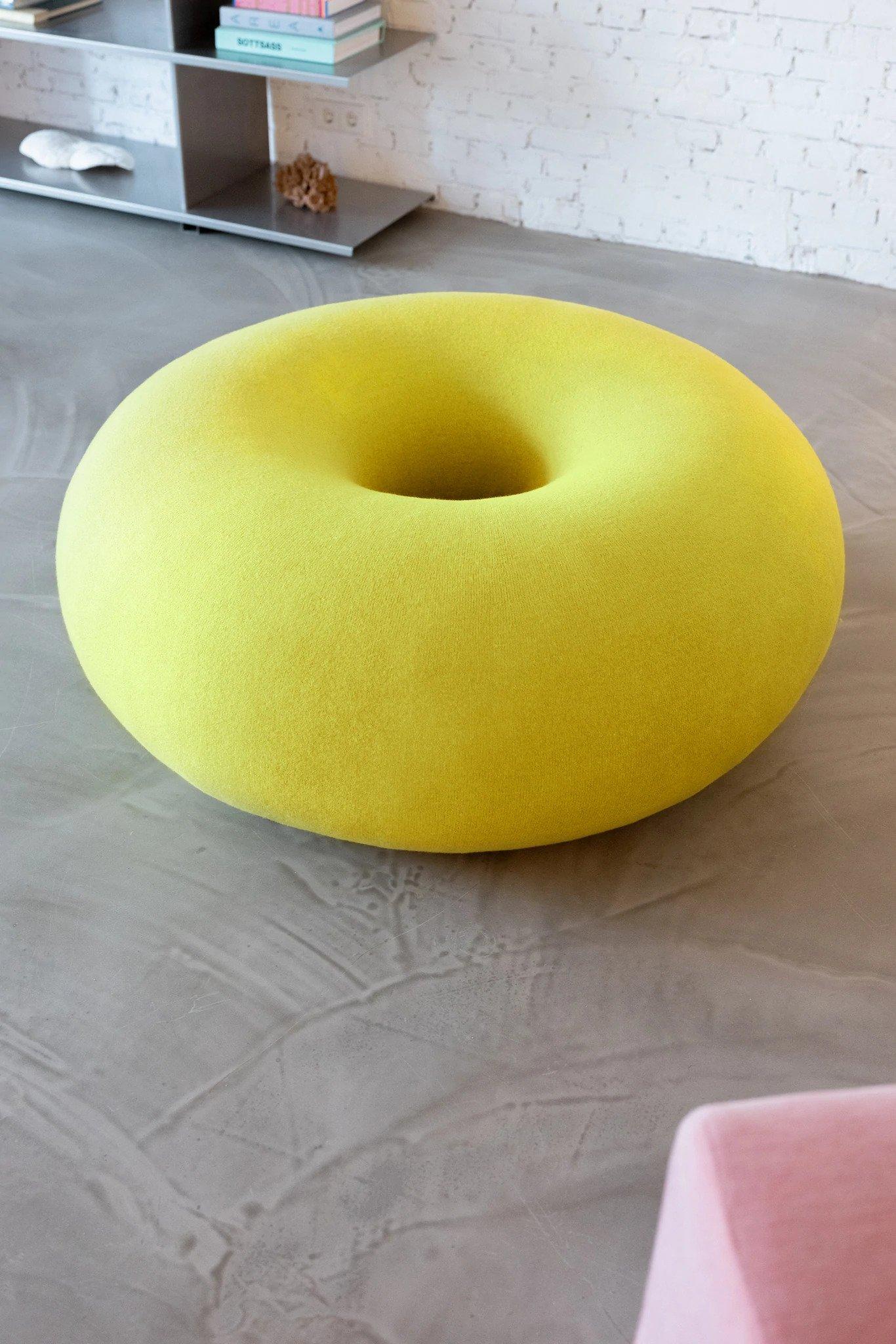 The donut-shaped Boa Pouf by Sabine Marcelis is perfectly sculptural, a bold graphic form that interrupts interior landscapes with its faultless chunky geometry. This piece of upholstered occasional furniture is rounded and soft, encased in a