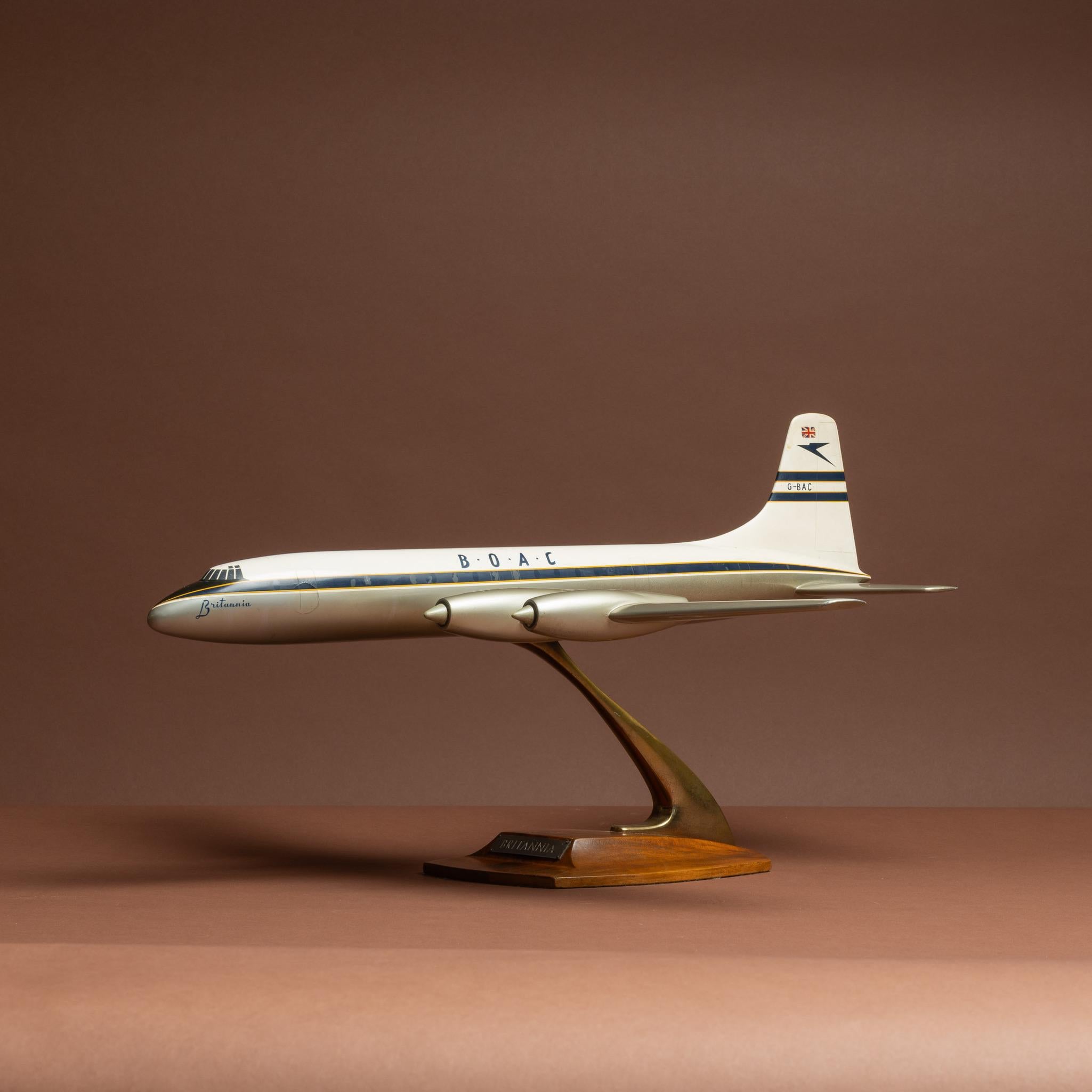 A wonderful cast aluminium painted model of a Bristol Britannia airplane in BOAC livery, mounted on original stand with wooden base. By Walker's Westway Aircraft Models, circa 1957.

Dimensions: 53 cm/20¾ inches (length) x 59 cm/23¼ inches (wing