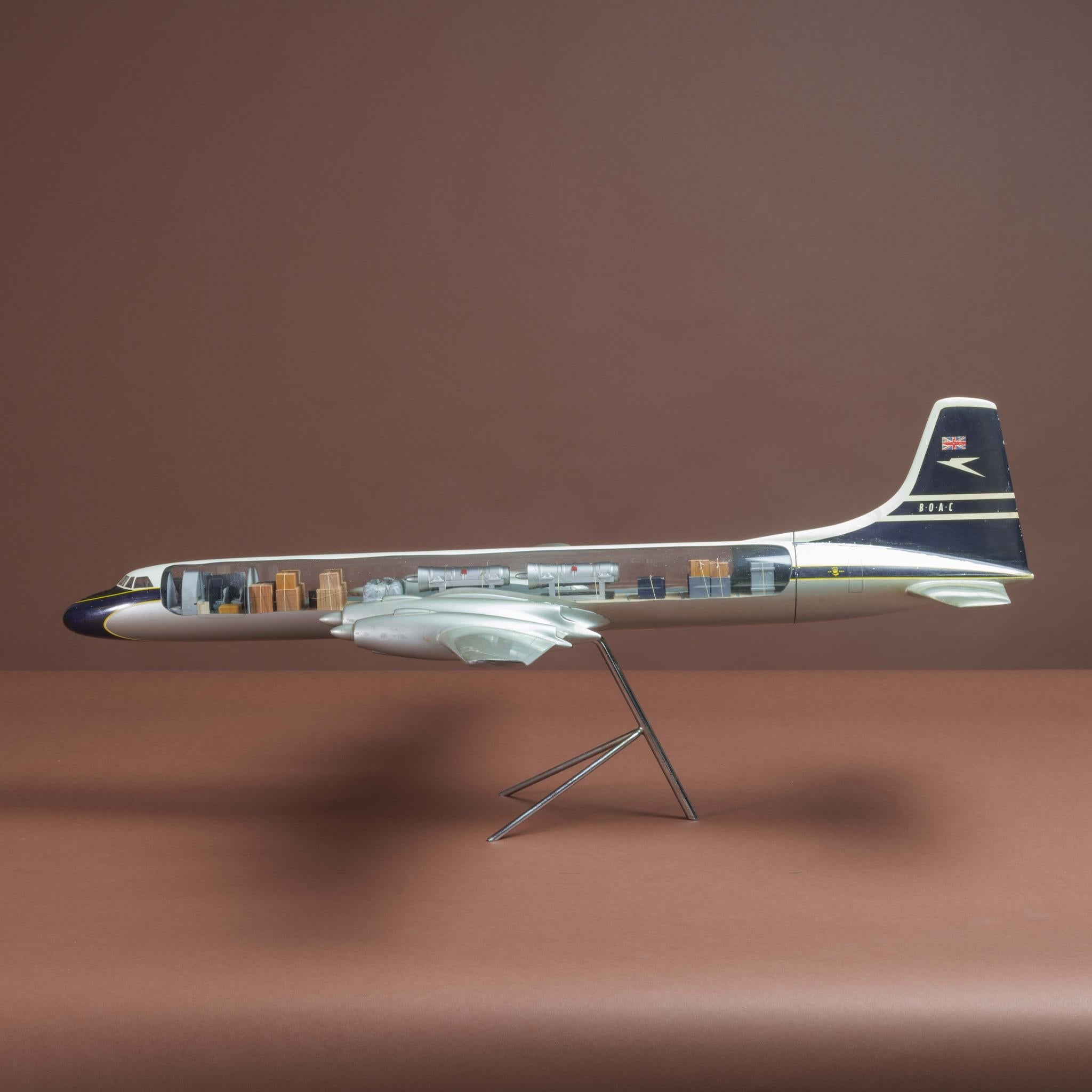 A wonderful and rare painted cut-away model of a Canadair CL-44D4-1 in BOAC livery, mounted on original stand.

Made for BOAC by Mastermodels Ltd of Feltham and presented, in about 1963, to a director of C.Claridge shipping agents who once