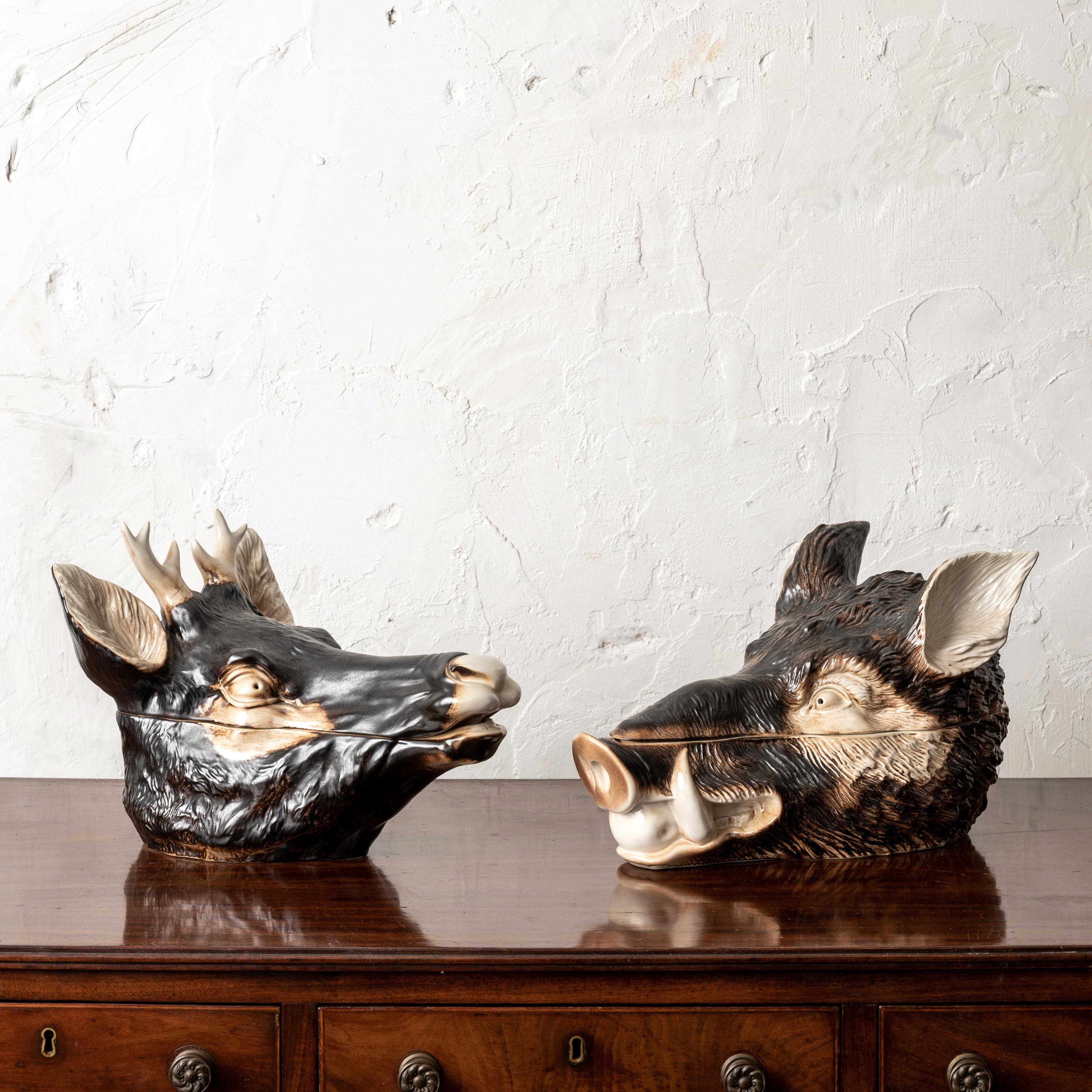 A pair of Italian majolica boar and stag head tureens, mid 20th century.

16 ½ inches wide by 11 inches deep by 10 inches tall

