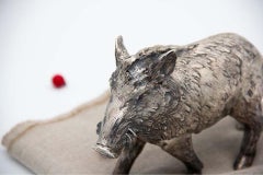 Boar in profusely embossed silver