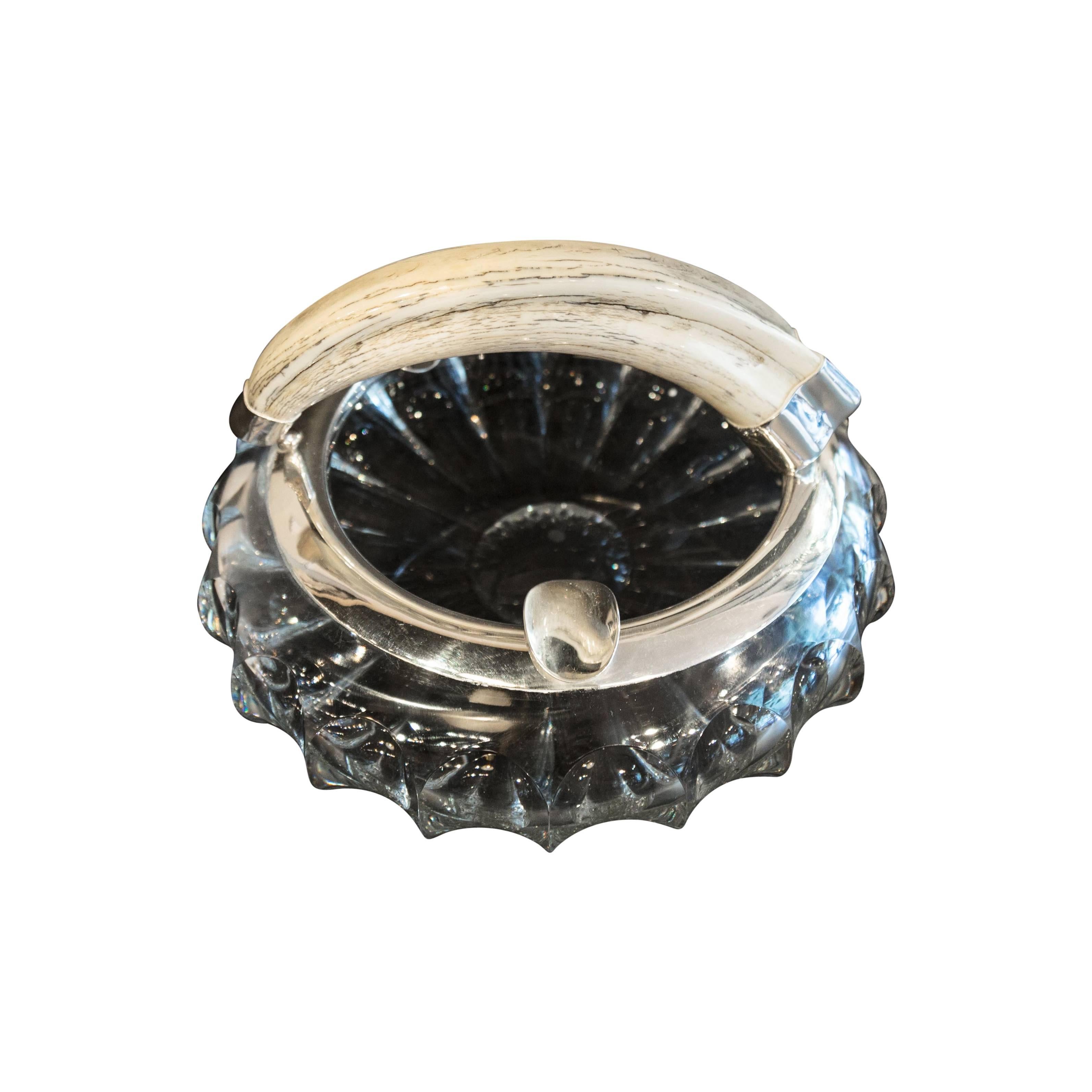 A crystal cut-glass and boar tooth silver rim ash tray, circa 1920. The sterling silver has its certified stamp. A brilliant edition to any bar, office, or lounge.