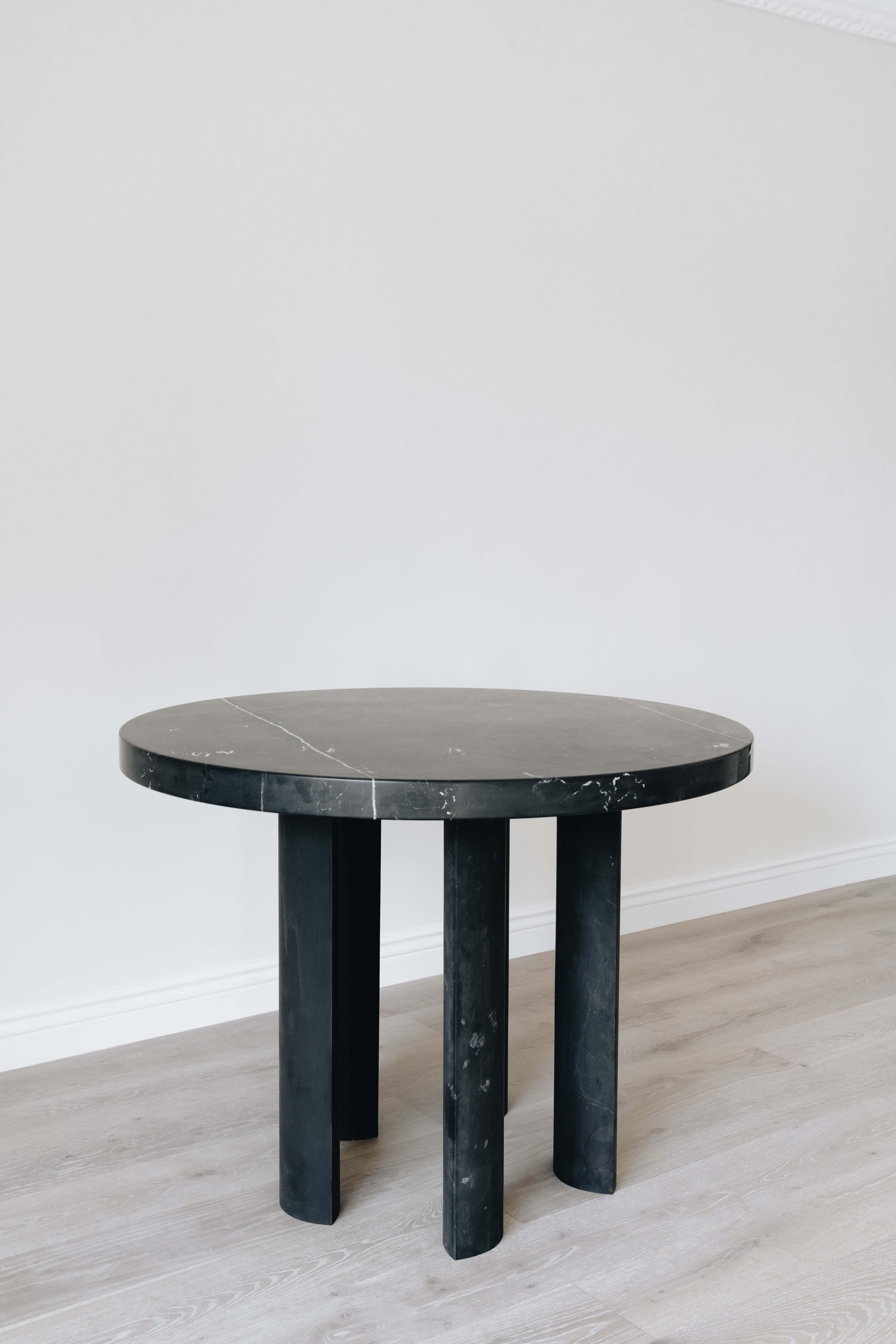 Sculptoric solid black Monterrey marble table, handmade in Mexico City. This table consists of 5 solid marble legs and one 110 cm diameter tabletop which are sent sepparately to be assembled on site.

Tribute to Adamo Boari, Italian-Mexican