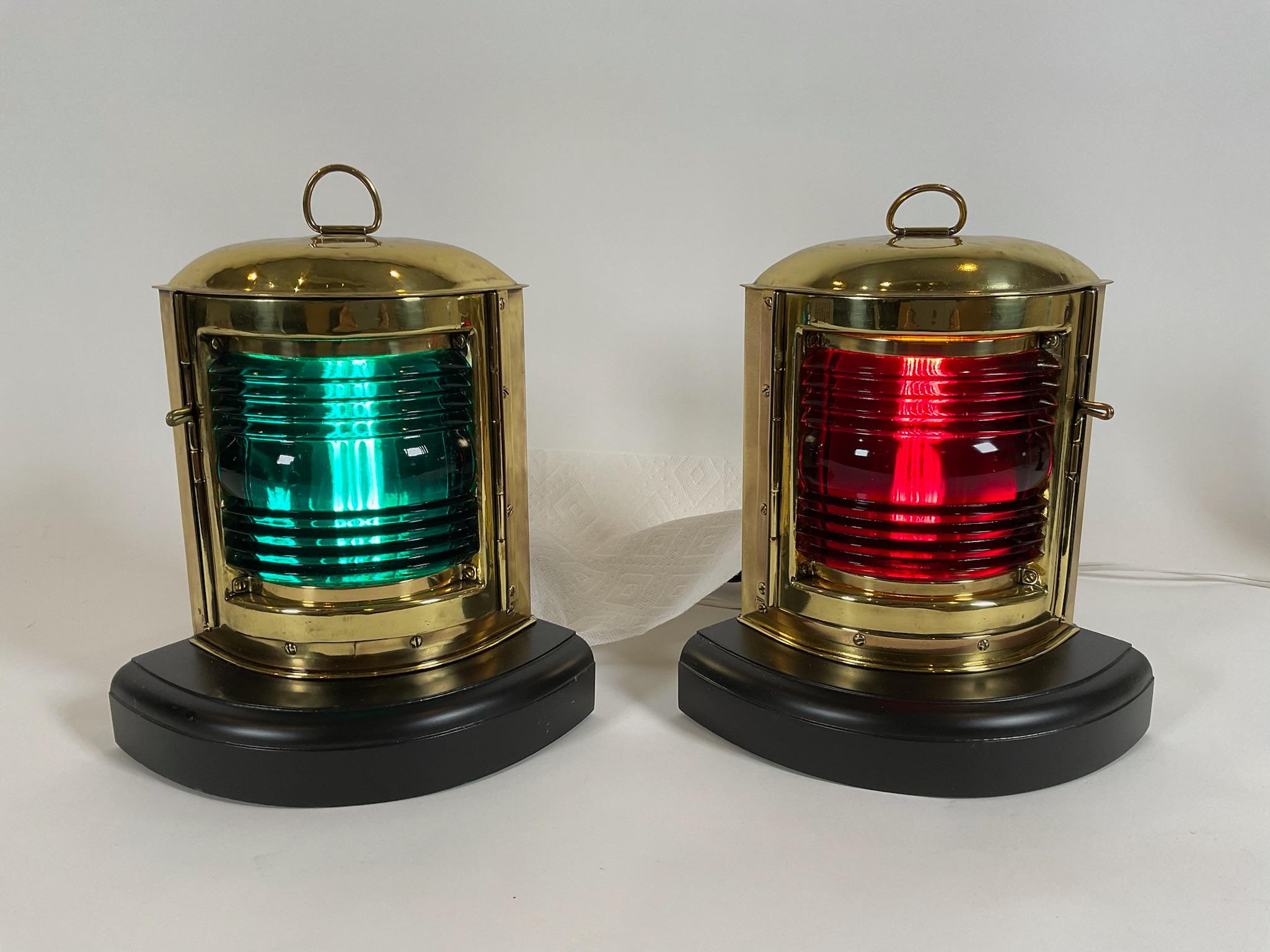 Pair of Port and Starboard Ships Lanterns in Highly Polished and Lacquered Brass. Fitted with richly colored red and green lenses. Mounted to thick wood bases. Wired.

Weight: 5 lbs. EA
Overall Dimensions: 11