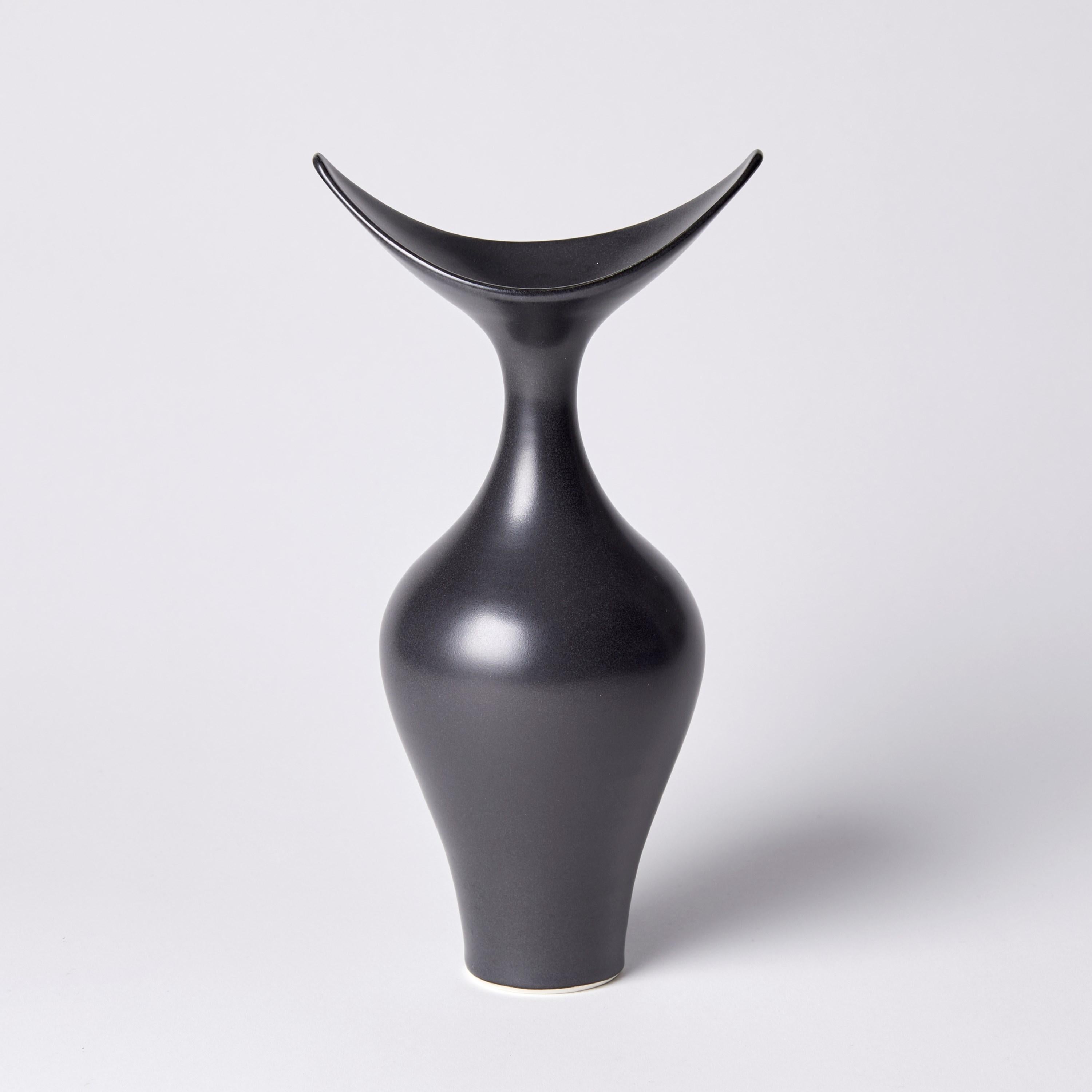 ‘Boat Necked Vase I’ is a unique porcelain sculptural vessel by the British artist, Vivienne Foley. 

Vivienne Foley is based in Gloucestershire where she produces exquisite ceramic sculpture. Although in essence they are often functional pieces