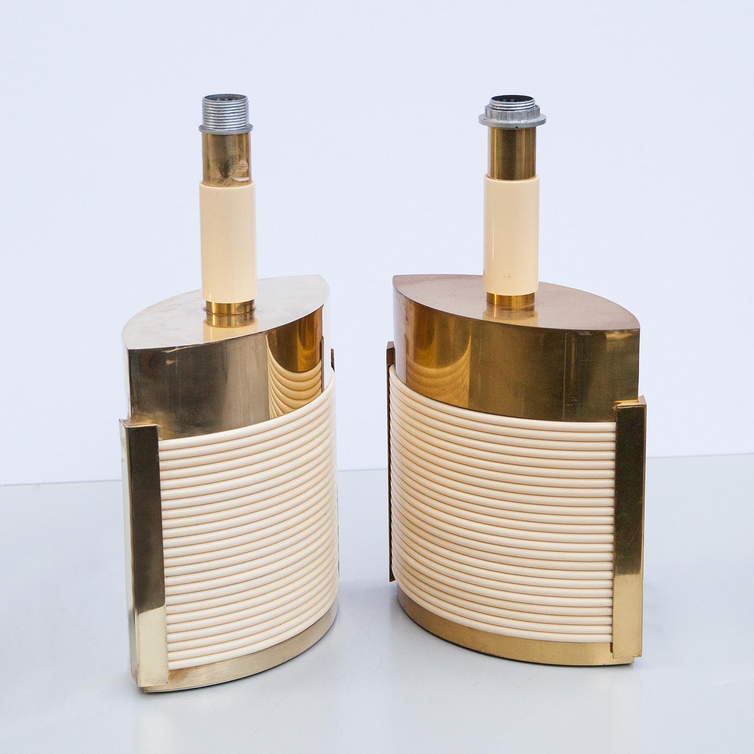 Elegant set of two brass table lamp with fake ivory rods decoration attributed to Romeo Rega, Italy, 1960s.