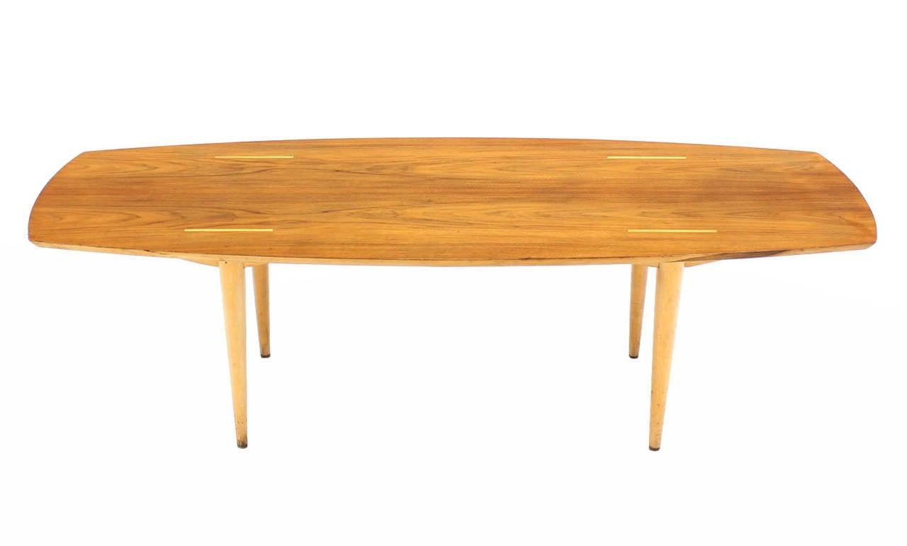 20th Century Boat Shape Light Walnut Tapered Birch Exposed Leg Tenon Coffee Table Mid Century For Sale
