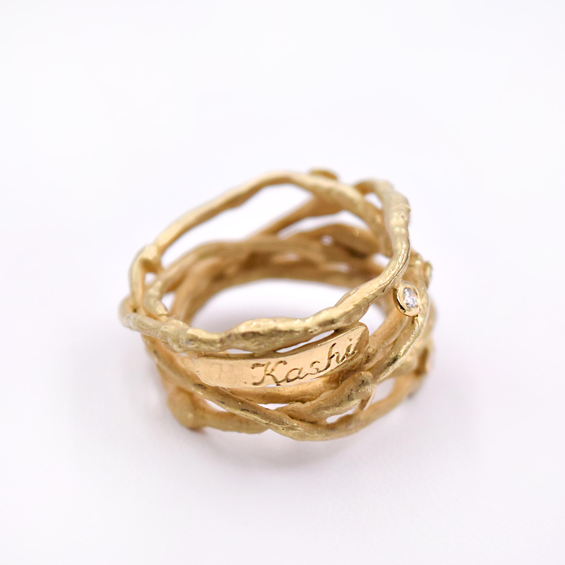 One of a kind gold wire ring with diamonds designed by Boaz Kashi in Tel Aviv. 
The total carat weight of the round, white diamonds is 0.22ct and the metal is 18K matte yellow gold.
Size of the ring is 7.