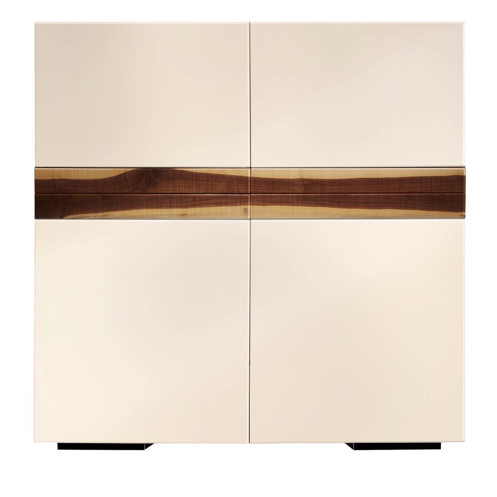This bar cabinet is a sophisticated piece that will add a curated accent to a modern home. Entirely finished with a glossy ivory polyurethane lacquer, it features four doors opening onto a large storage space lined with dark stained mirrors and