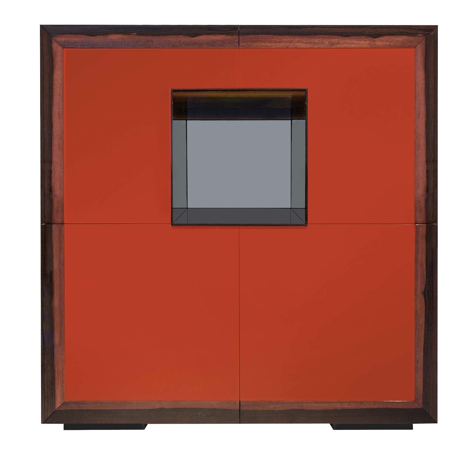 Defined by pure geometry, this bar cabinet is as functional as it is sophisticated and will elevate any dining room with its bold colors and modern lines. The red china polyurethane lacquer of the square structure is complemented by the Macassar