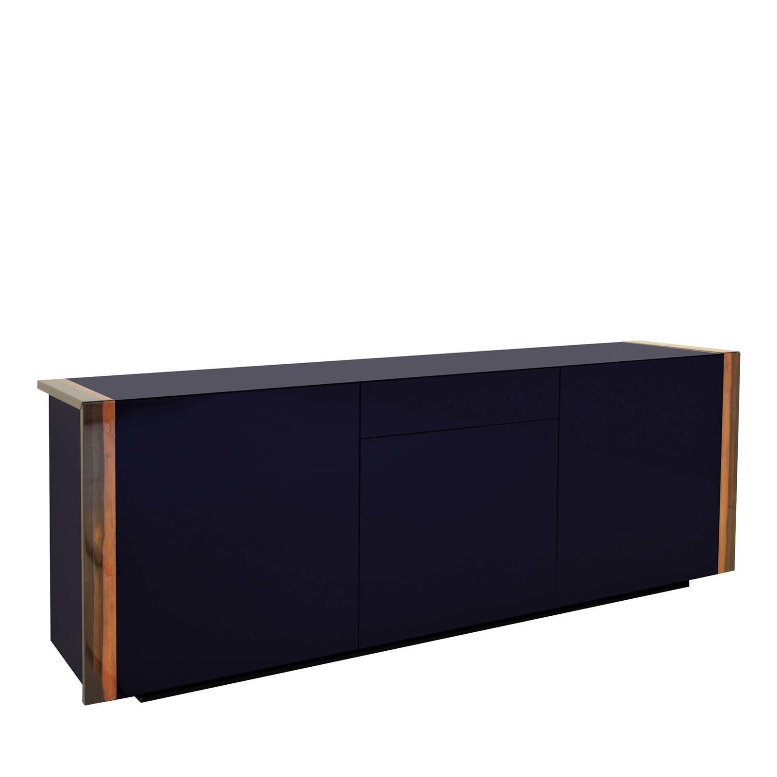 Stately yet elegant, this sideboard allows for elegant organization thanks to three compartments, each including internal shelves, and a central top drawer. The linear structure of this versatile piece is finished in indigo-lacquered polyurethane