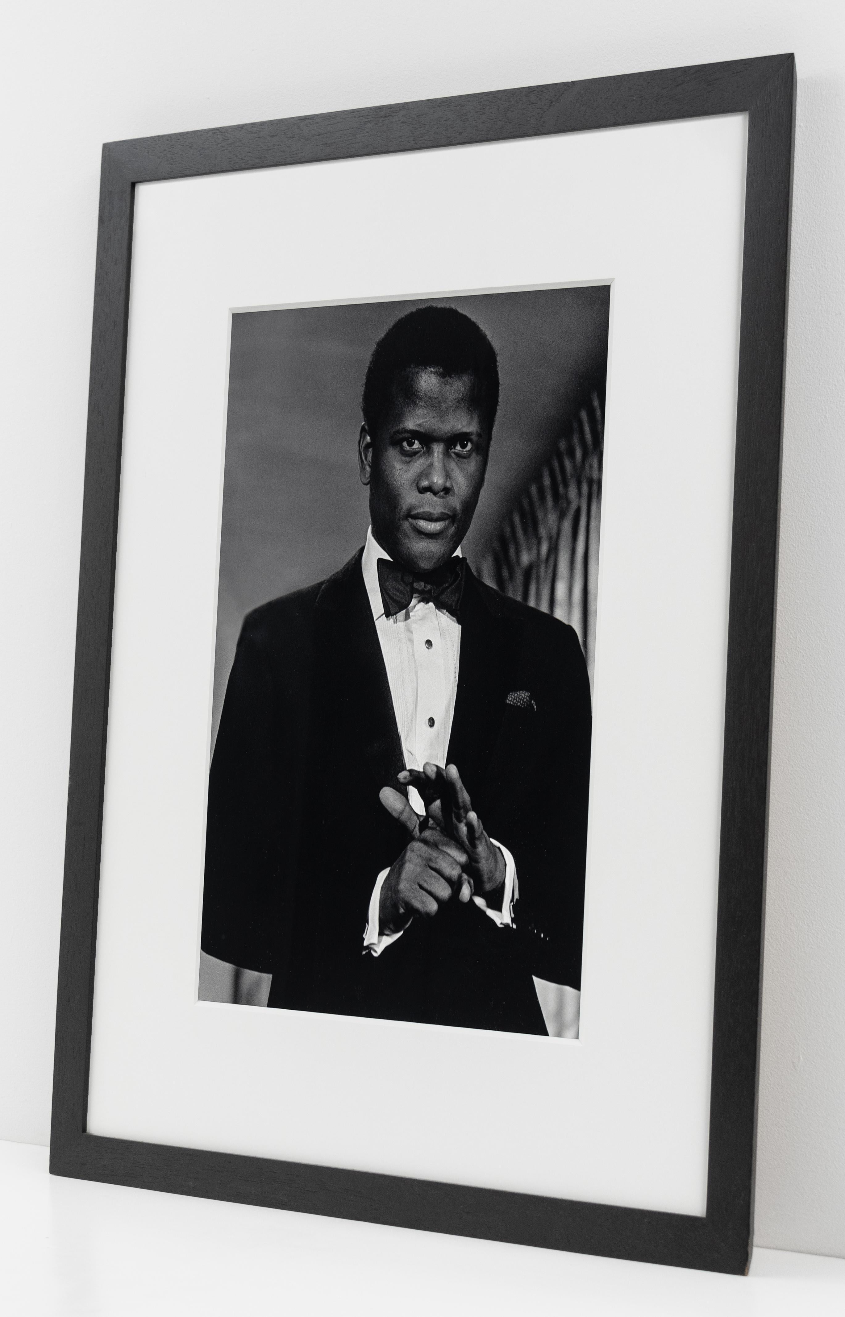 This black and white portrait of Sidney Poitier at the Oscars by Bob Adelman is offered by CLAMP in New York City.