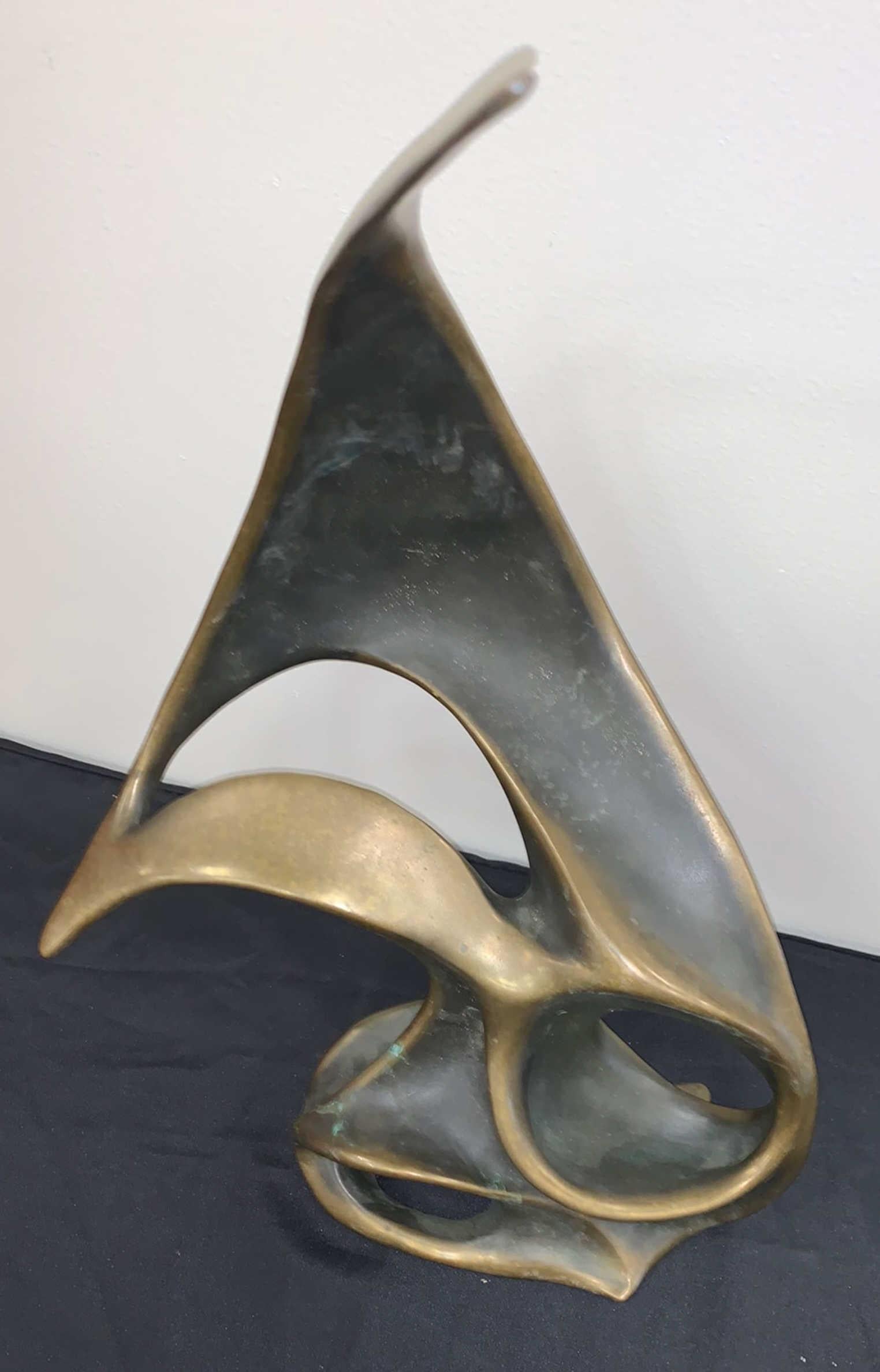 Beautiful abstract bronze freeform sculpture with sleek asymmetrical curves by world renowned sculptors Bob and Tom Bennett, identical twins who share a singular artistic vision. Their work is unmistakable, sculpted by hand and cast in bronze.