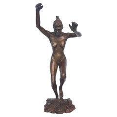 Scultura in bronzo di nudo che salta