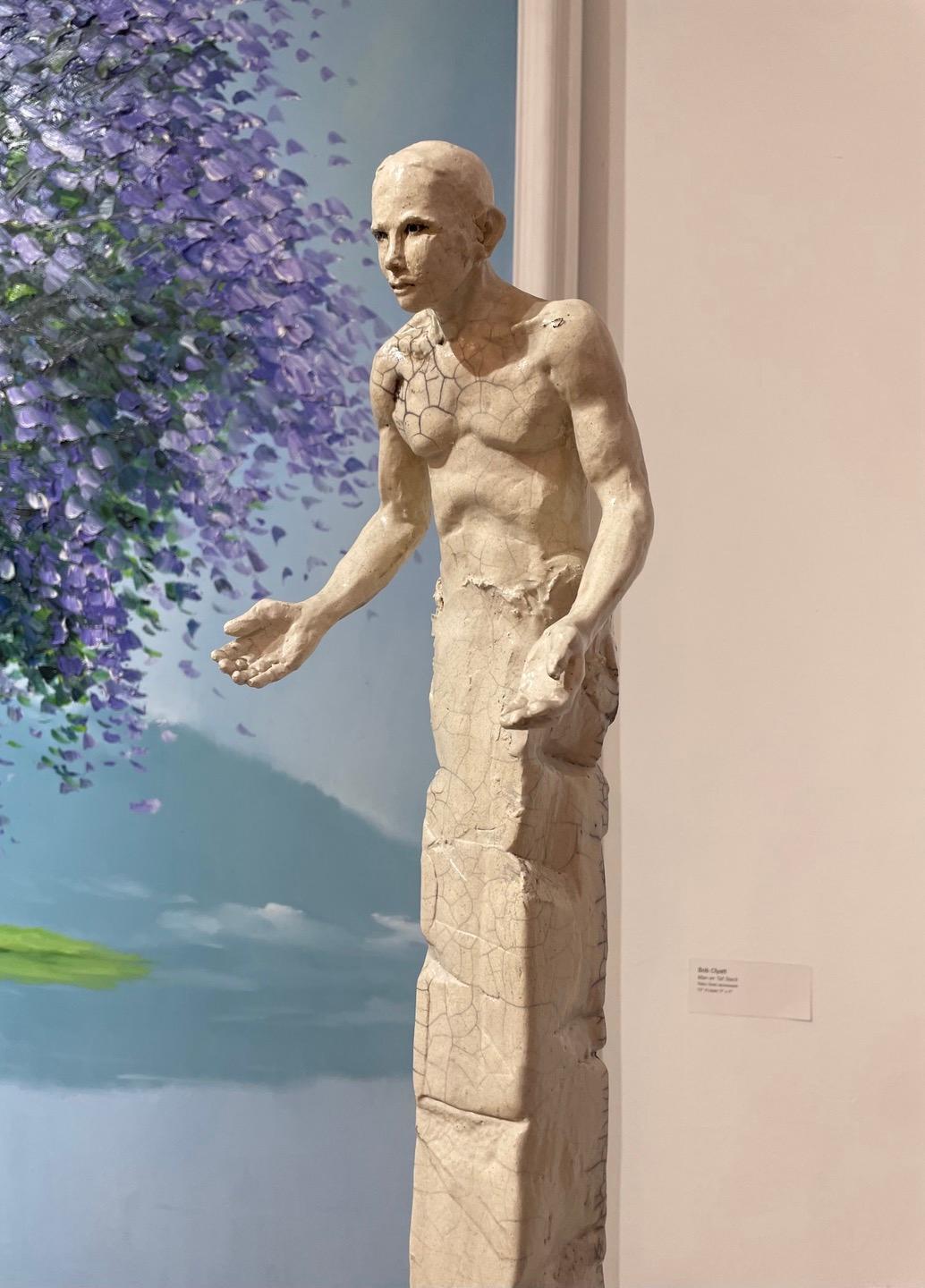 Bob Clyatt Figurative Sculpture - Man on Tall Stack