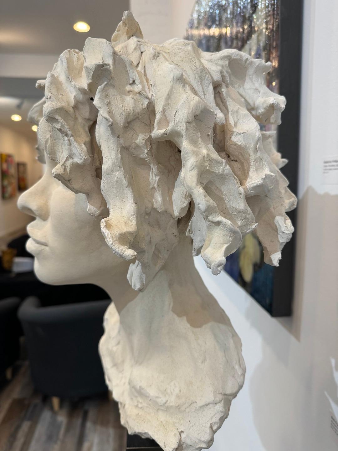 In my effort to make the sculpted bust a viable contemporary art form I have tried several approaches. This over-life-size piece is an example of my current preferred approach where a ‘tightly’ modeled head and expressive face is coupled with a