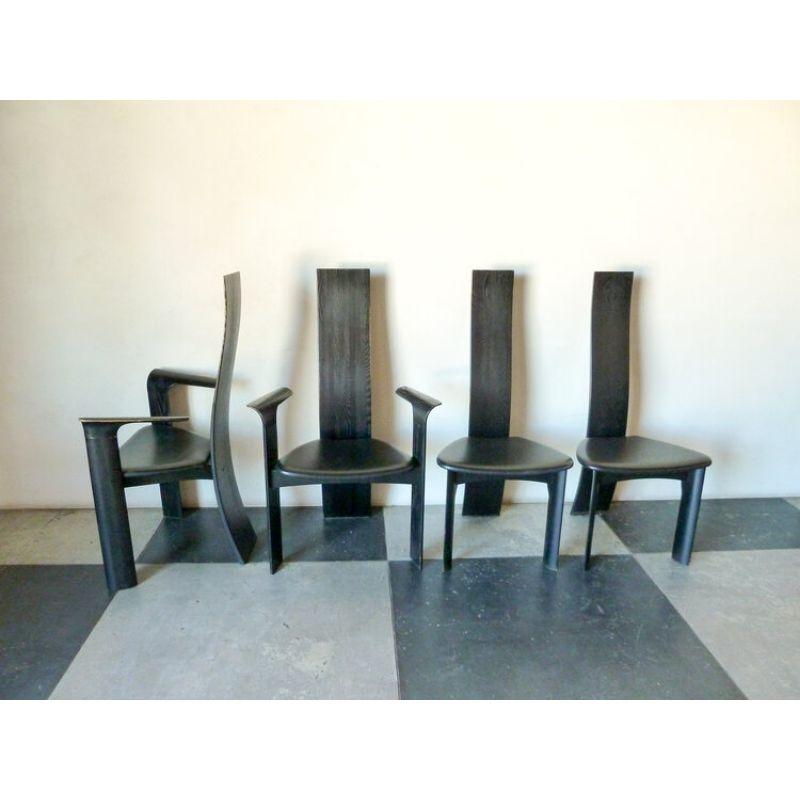 Set of six Bob & Dries Van Den Berghe ‘Iris’ high back dining chairs in black. Two armchairs and four side chairs (two not pictured).
Model 'Iris' for Tranekaer Furniture, frame maple wood, black glazed, seat upholstered in black calfskin, on the
