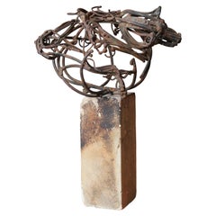 Small Abstracted Iron Rounds Sculpture on a Square Stone Base
