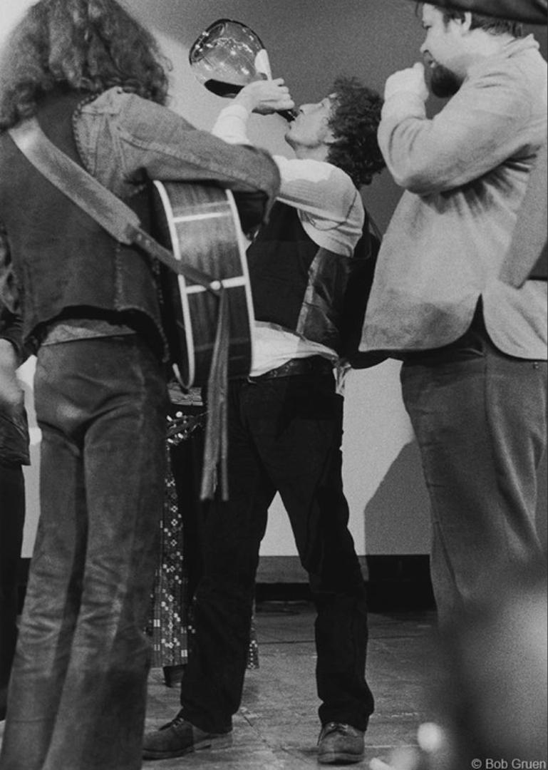 Bob Gruen Black and White Photograph - Bob Dylan, Drinking Wine, 1974