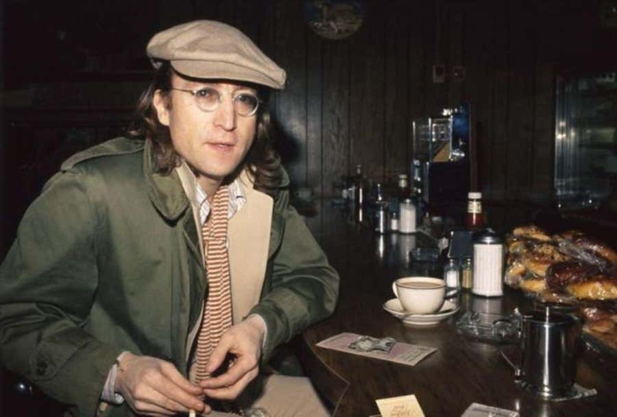 John Lennon sitting at cafe in Yonkers, NYC 1975