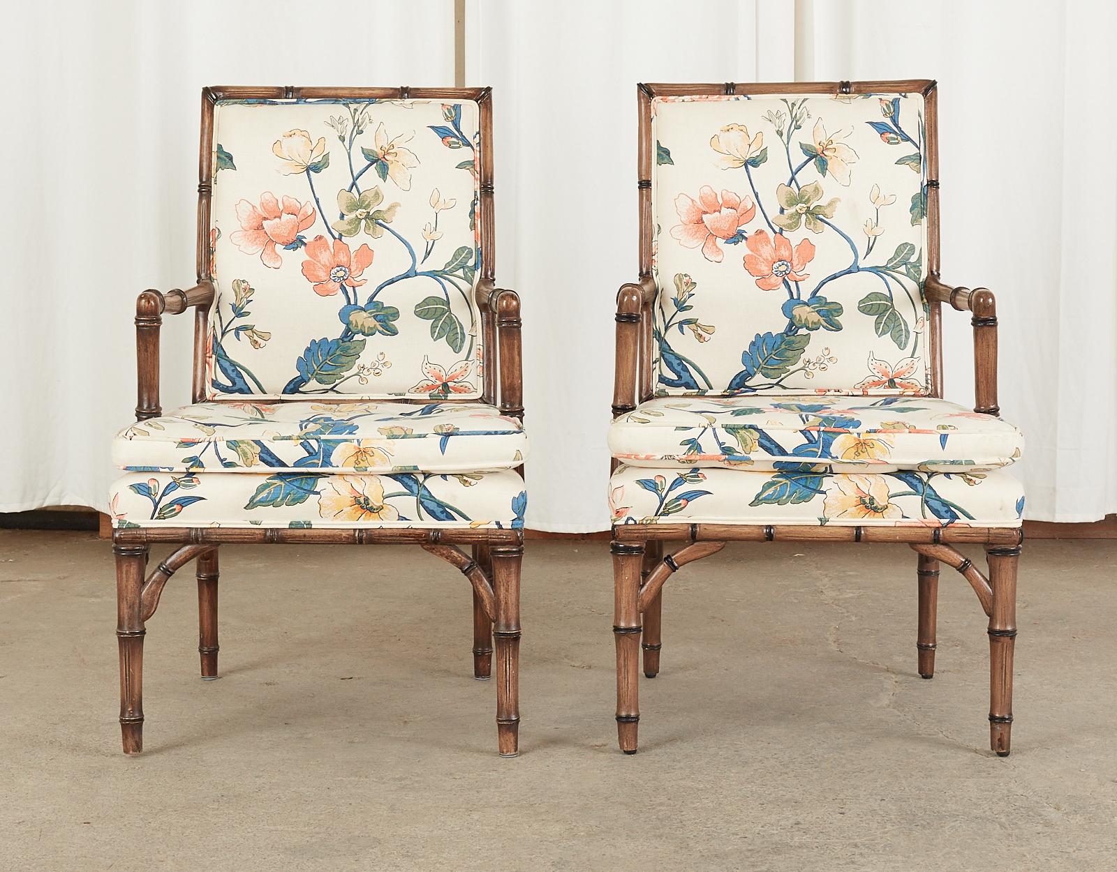 Mid-Century Modern set of four dining armchairs from the estate of Bob and Dolores Hope on Southridge Drive in Palm Springs. The chairs feature Hollywood regency style carved faux bamboo frames that were re-upholstered in 1996 to the floral chintz