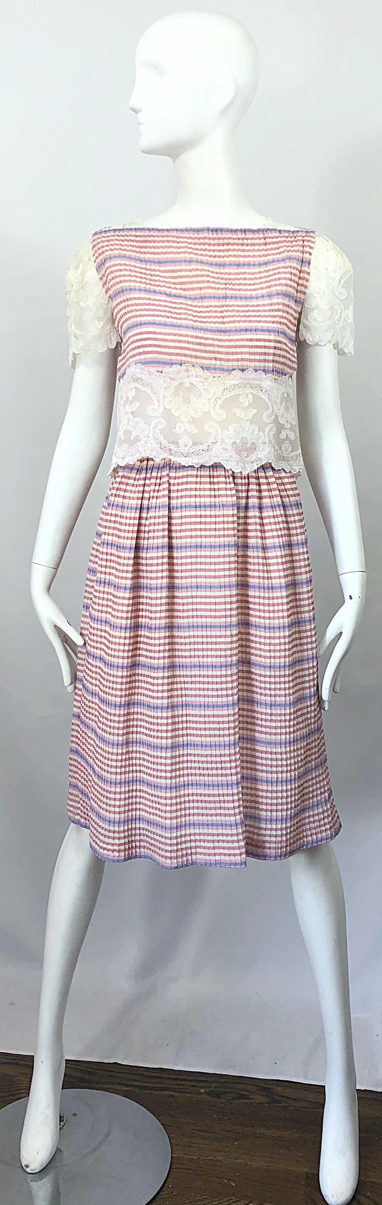 Pretty vintage BOB MACKIE (late 70s) stripes silk and lace crop top and skirt ensemble! Features pleated silk with stripes printed in purple, pink and ivory. White lace cut-out at waist is lined in nude chiffon. Lace cut-outs at each shoulder as