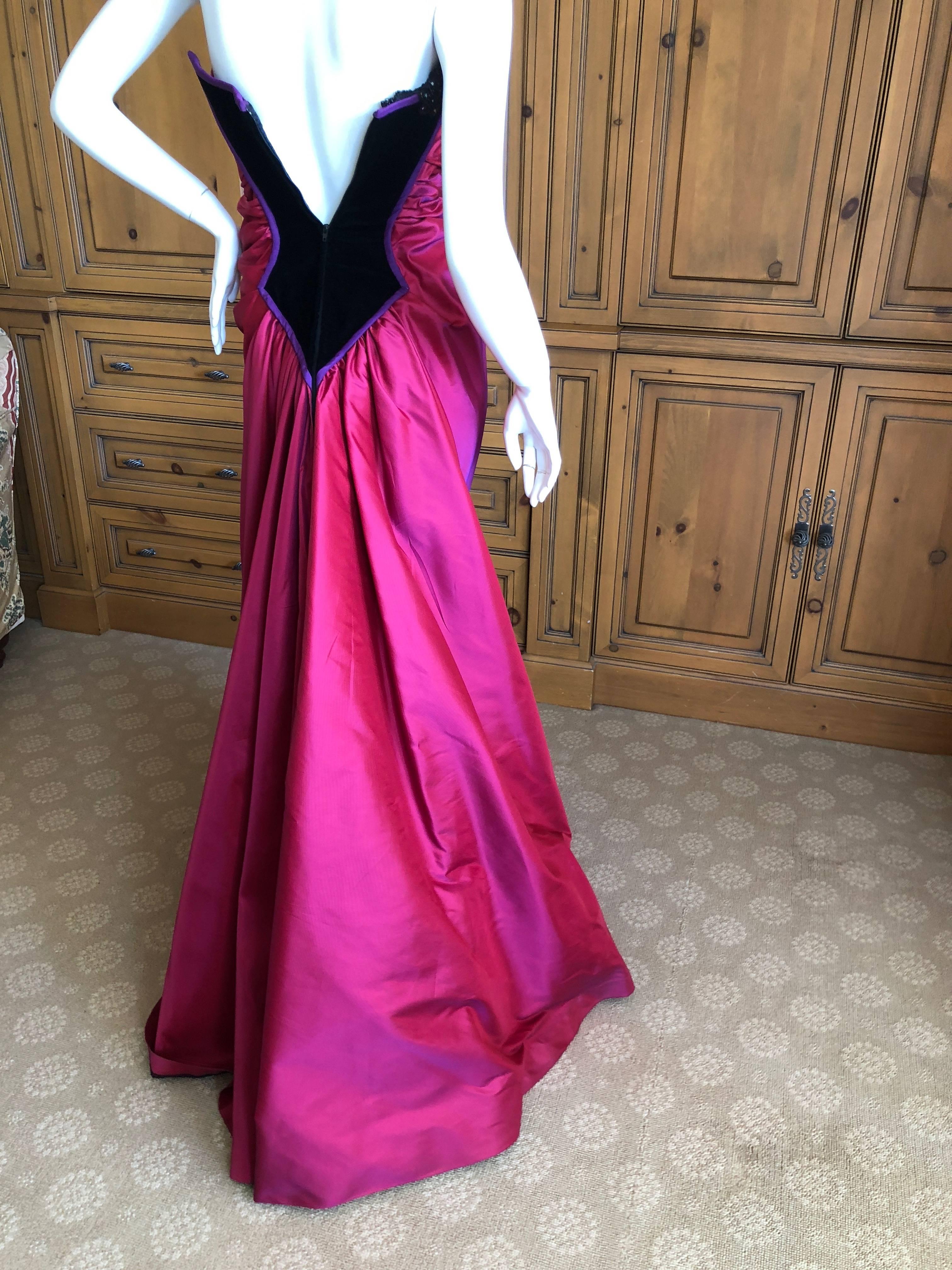 Bob Mackie 1980's Glamorous Magenta Ballgown with Crystal Beaded Accents
This is so romantic, the skirt is very full with under layers expertly draped.
The corset top is embellished with crystals at the bust.
There is a full inner corset bra.
Size
