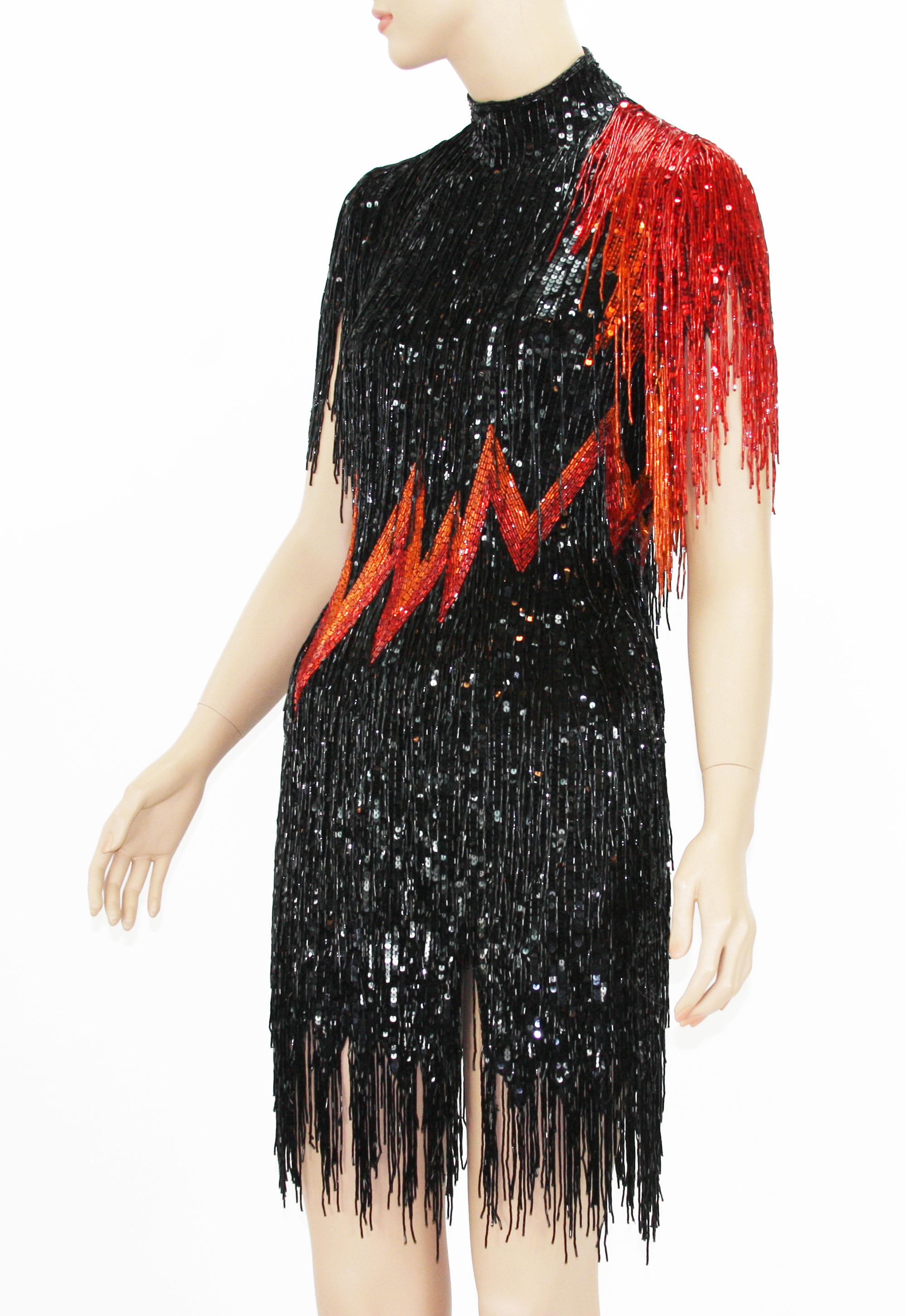 Bob Mackie *Flame* Fully Beaded Fringe Dress
1982 year Collection 
Fully Beaded in Black, Red and Orange.
Size label missing.
Measurements: Length - 34 inches + 4 fringe, Bust - 34/36