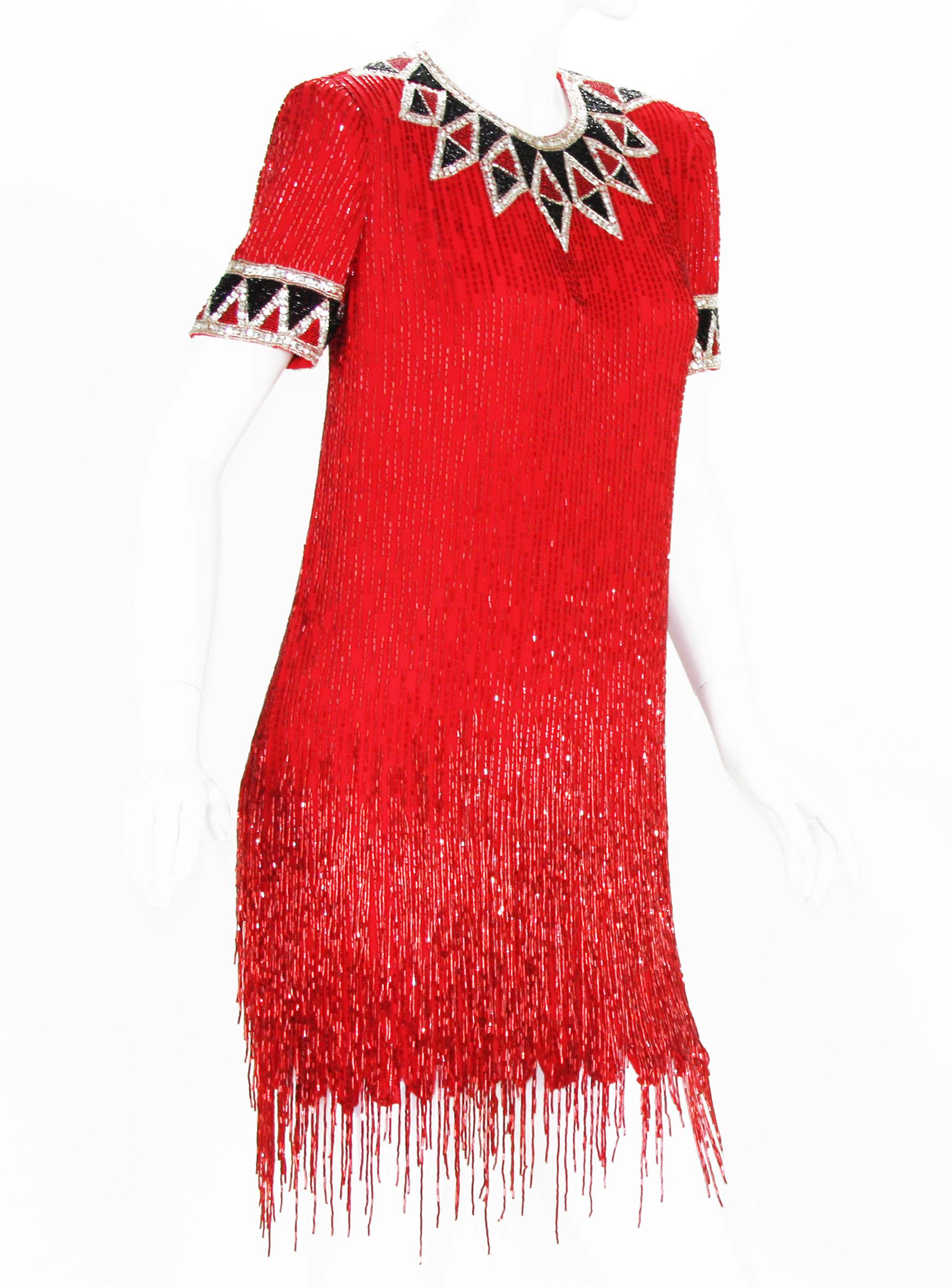 Bob Mackie Boutique Red Fully Beaded Cocktail Fringe Dress
Designer sizes available - 4 and 8
Mid 1980s, Embroidered with Bead work Shimmying Fringes, Black and Silver-tone Geometric Design, Fully Lined, Back Zip Closure. 
Measurements: 
Size 4: