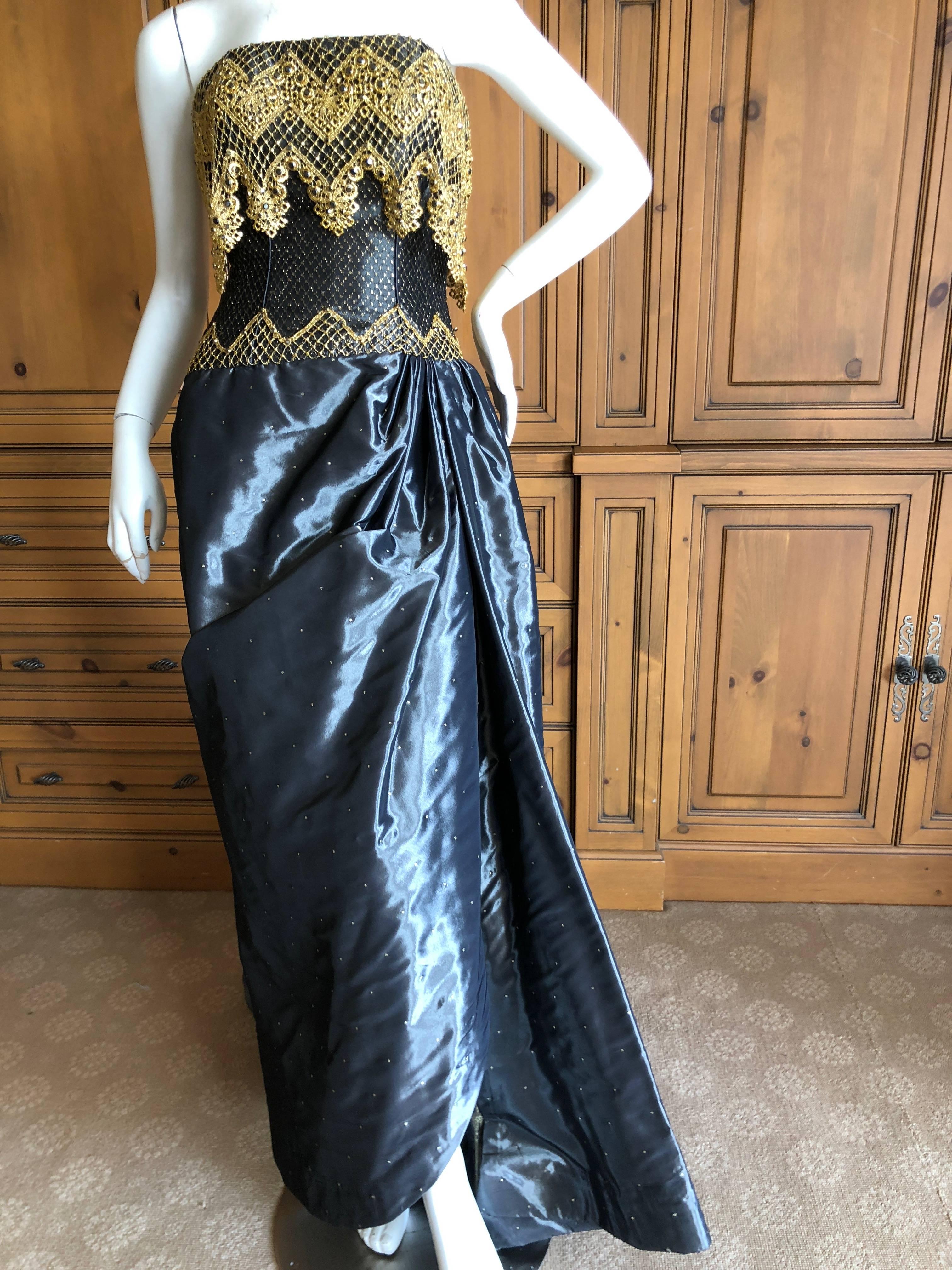 Bob Mackie 1980's Silk Strapless Evening Dress and Cape Coat from Neiman Marcus
Incredible bezel set crystal embellished gold lace on a strapless evening dress with matching cape coat There is a full inner corset bra.
Size 4
Bust 34