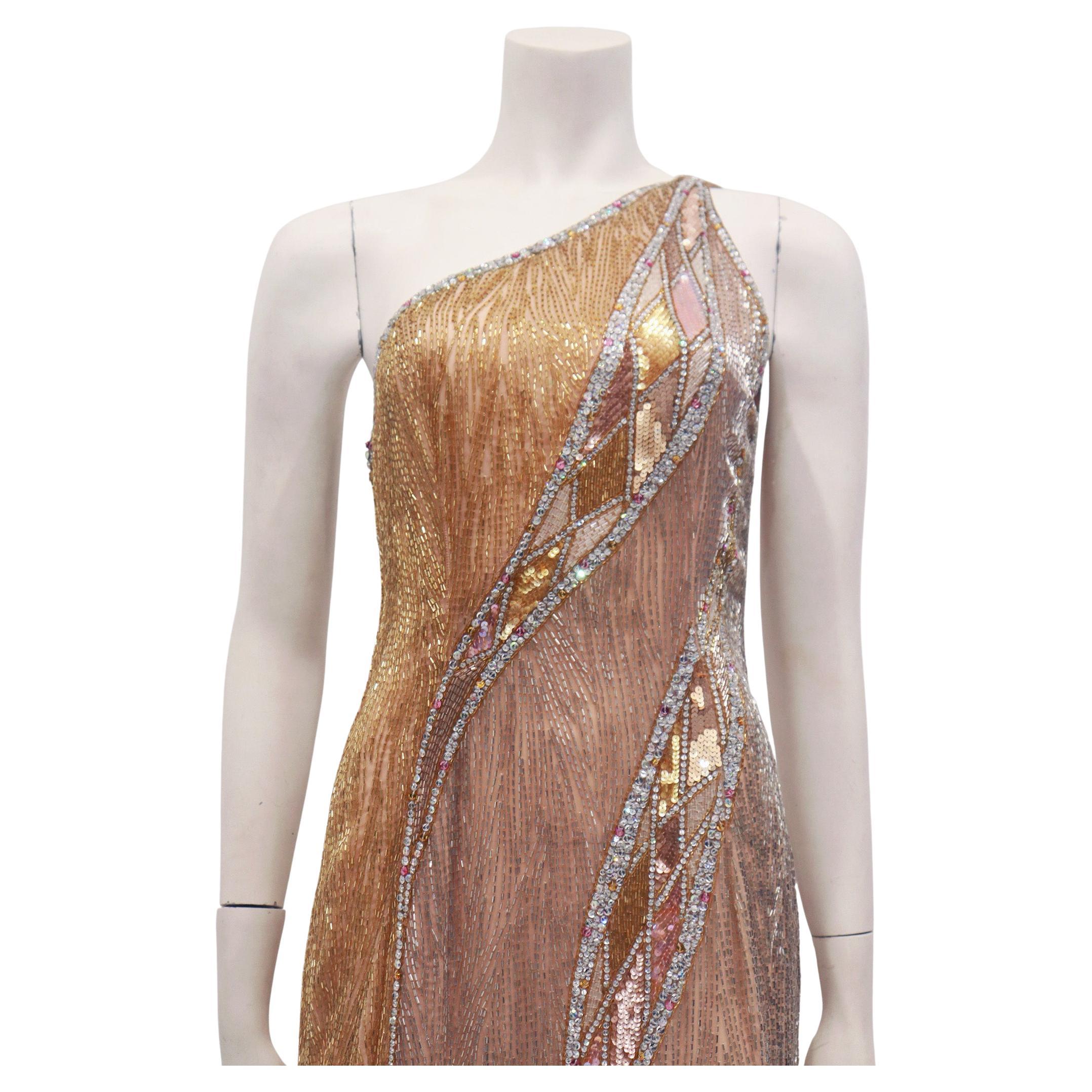 BOB MACKIE Vestido asimétrico de un hombro con cuentas de cristal y lentejuelas y flecos. Este vestido está como nuevo. 

No hay defectos significativos ni zonas de desgaste a tener en cuenta en este vestido de Mackie tan sexy. 
La bata se había