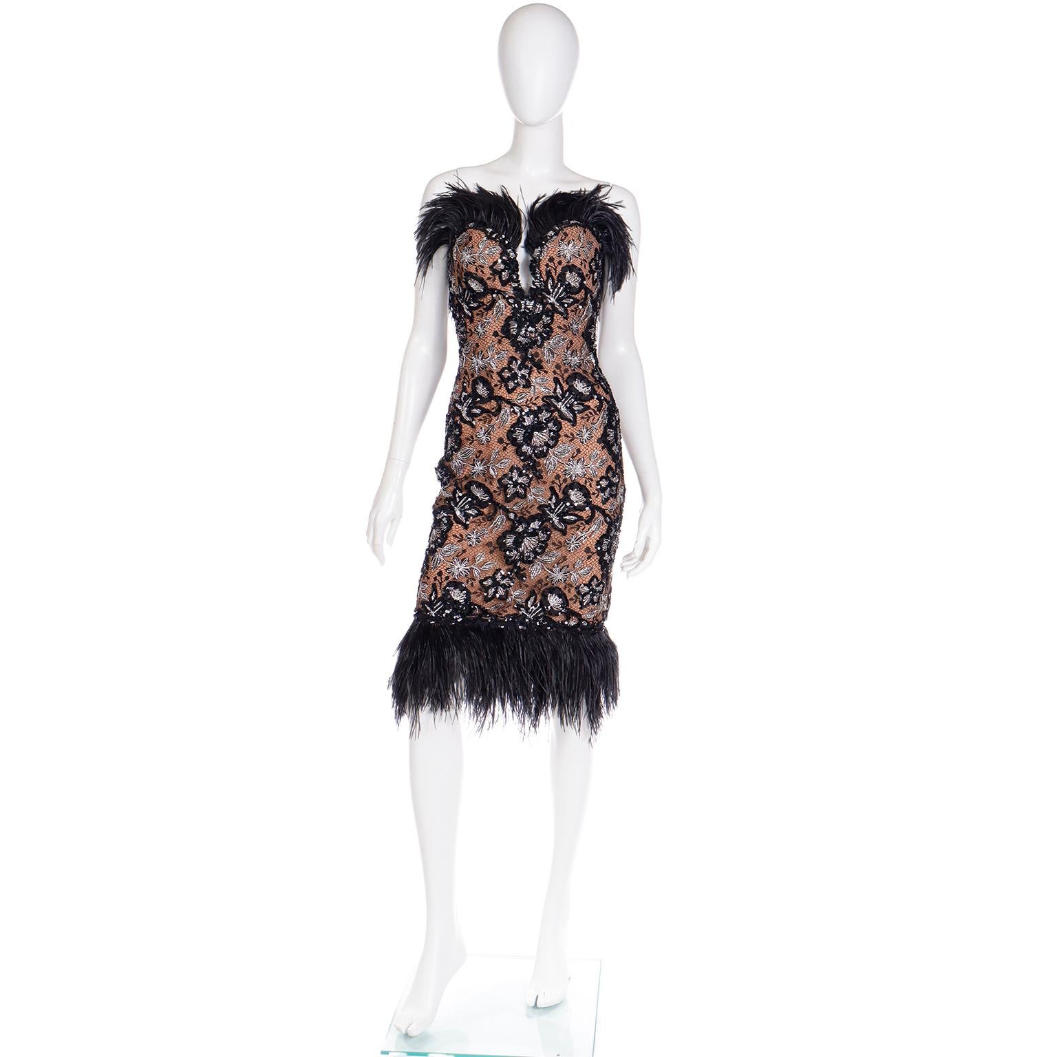 This is such a signature Bob Mackie dress with its sparkling sequins, silver metallic thread and gorgeous black feathers! This vintage Bob Mackie strapless dress was purchased at Saks Fifth Avenue in the 1980's. It's a perfect evening dress with its