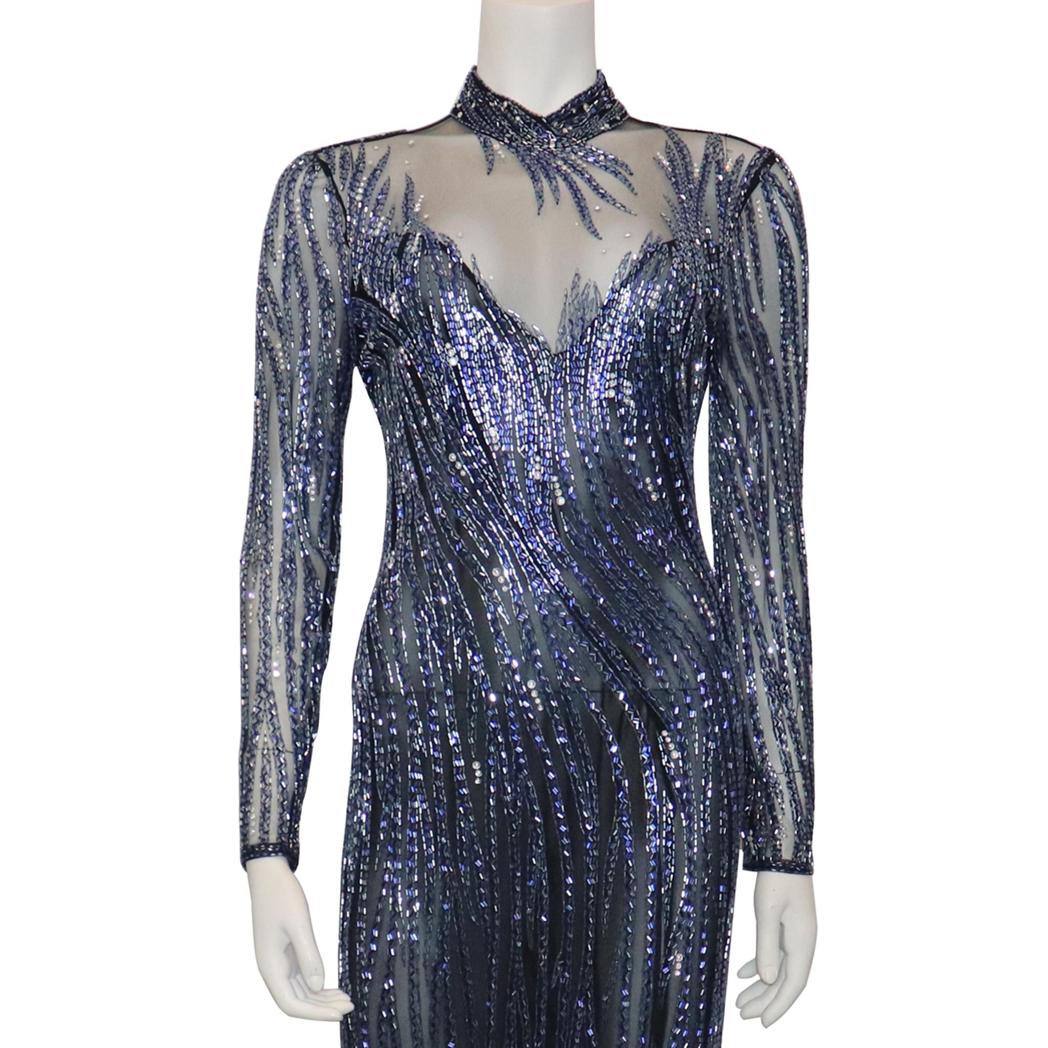 Bob Mackie Black Mesh w/ Blue Beading Long Sleeve High Neck Gown. In excellent condition 

Measurements - 

Size 10 

Dress Length: 61 Inches 
Bust: 24 Inches
Hip: 24 Inches
Shoulder to Arm: 25 Inches 