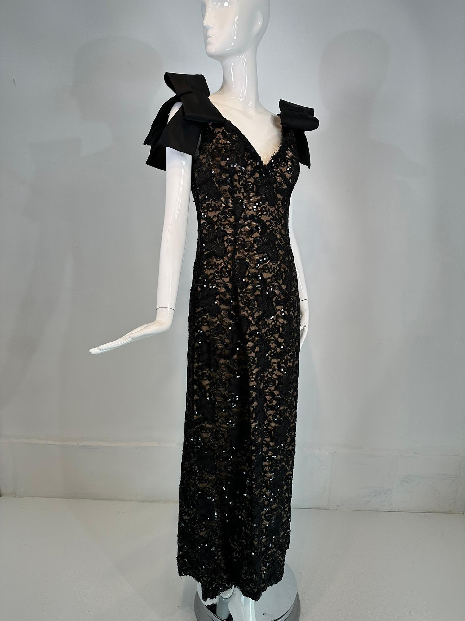 Bob Mackie black sequin embroidered lace evening gown with black silk shoulder ribbon bows, nude lining from the 1980s. Gorgeous evening dress with a low V neckline at the front & back, sexy and curve hugging it flares at the hem with a slight train